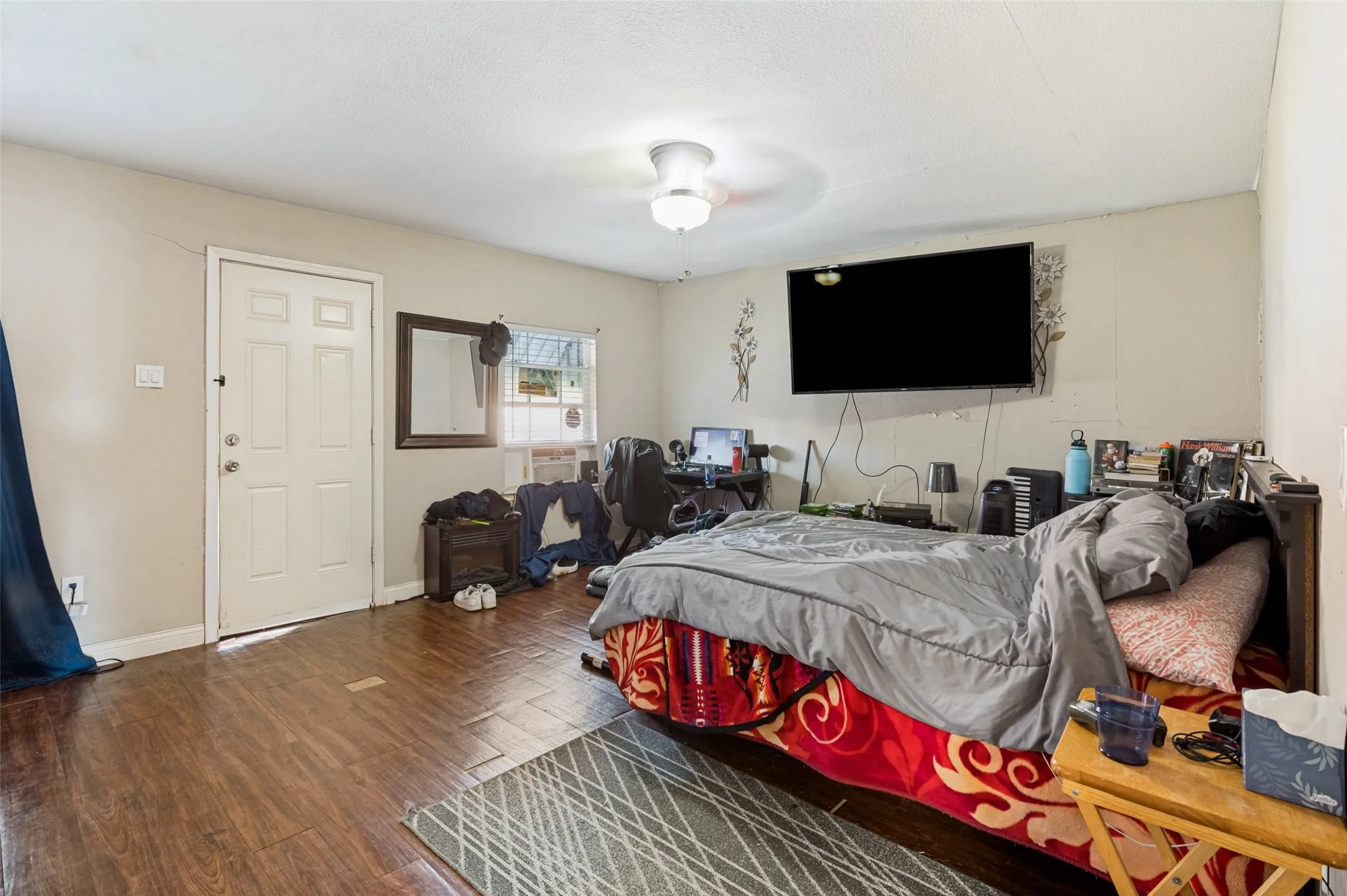 Bedroom #4 with ceiling fan and its own access to the backyard
