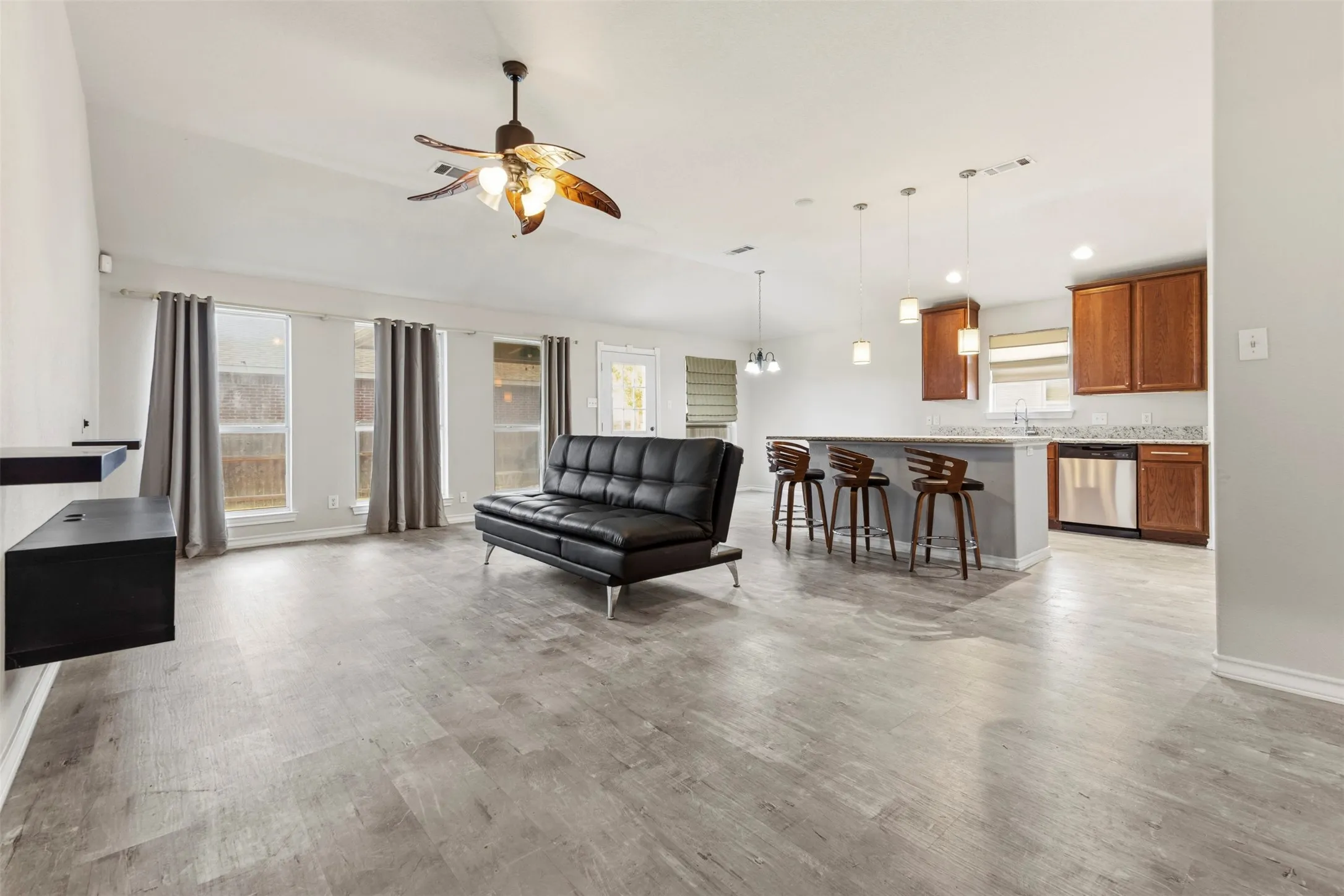The 10-foot ceilings create an open, airy feel throughout the living space, adding a sense of spaciousness and elegance.