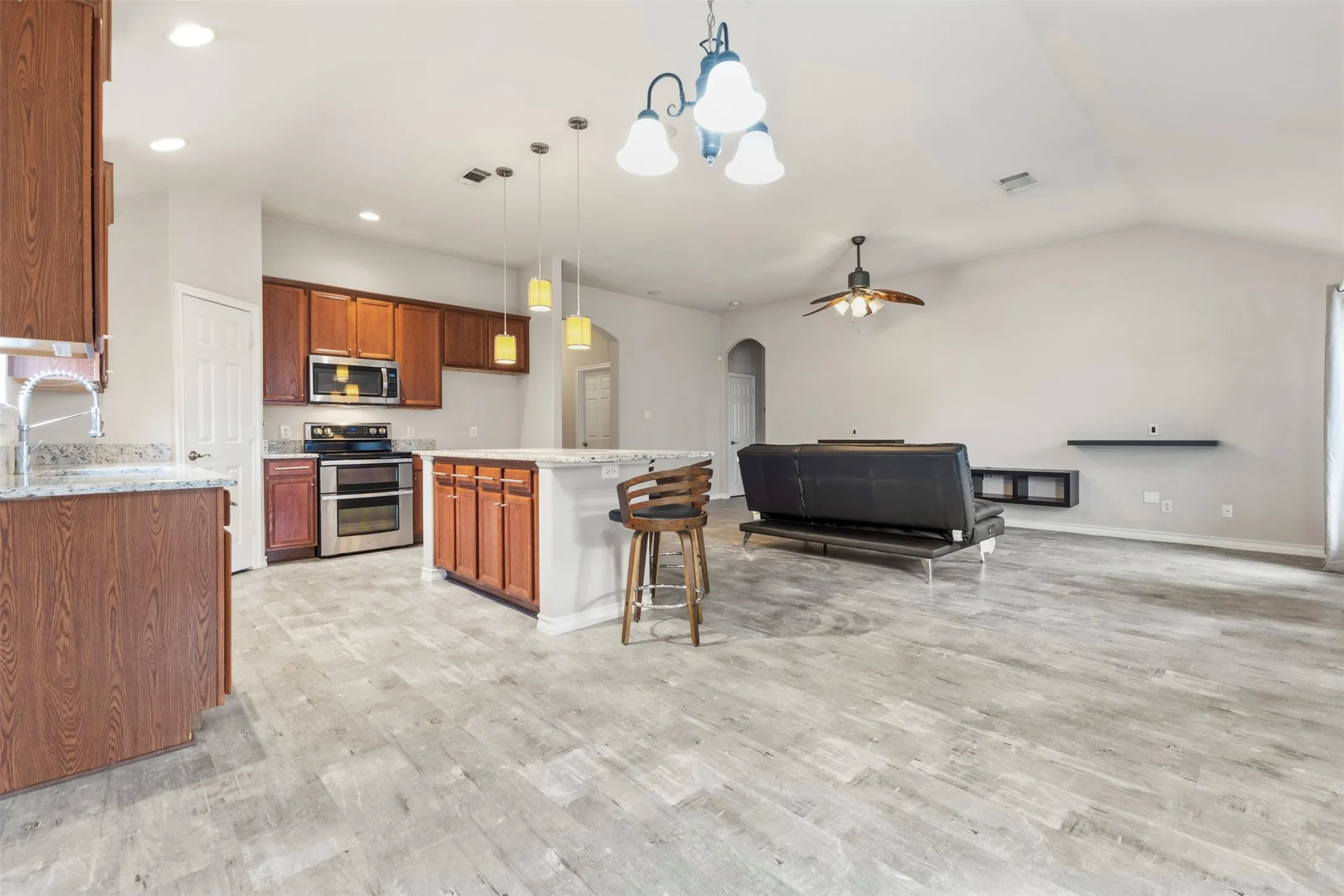 Open concept kitchen, dining and living.
