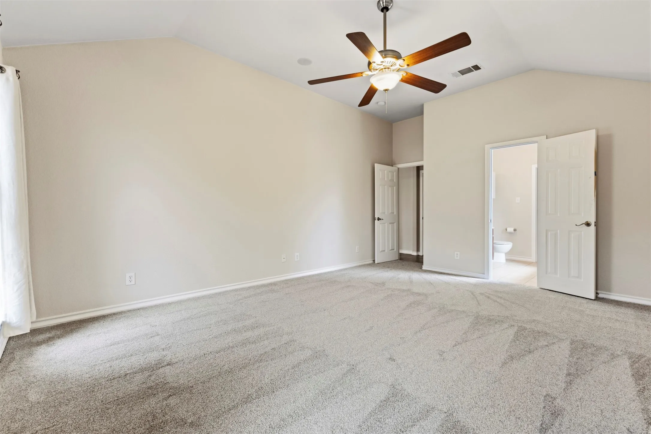 Fresh paint throughout and new carpet in the bedrooms, creating a clean, move-in-ready feel.