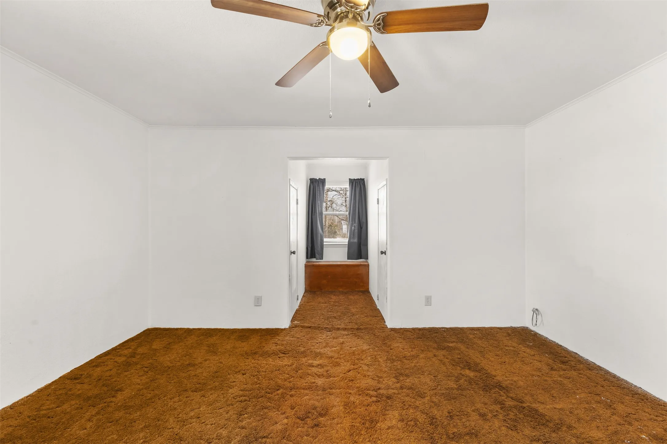 Recessed entryways, ceiling fan with light fixture, neutral wall color, and wall-to-wall carpeting