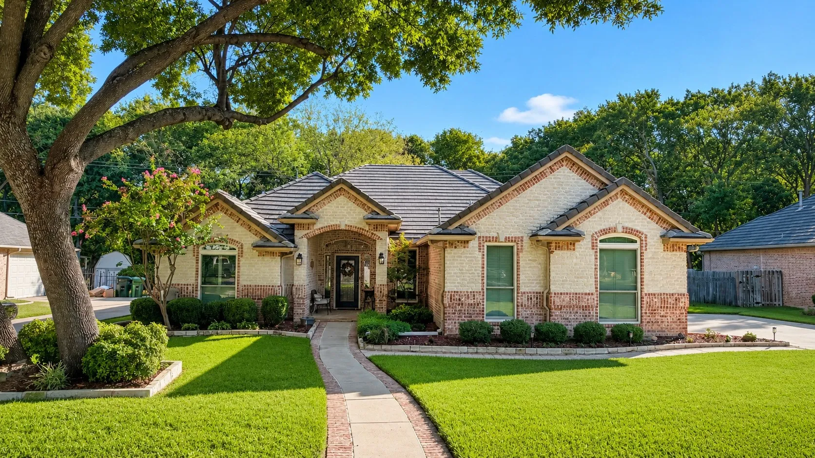 Brick and stone exterior with architectural shingle roof