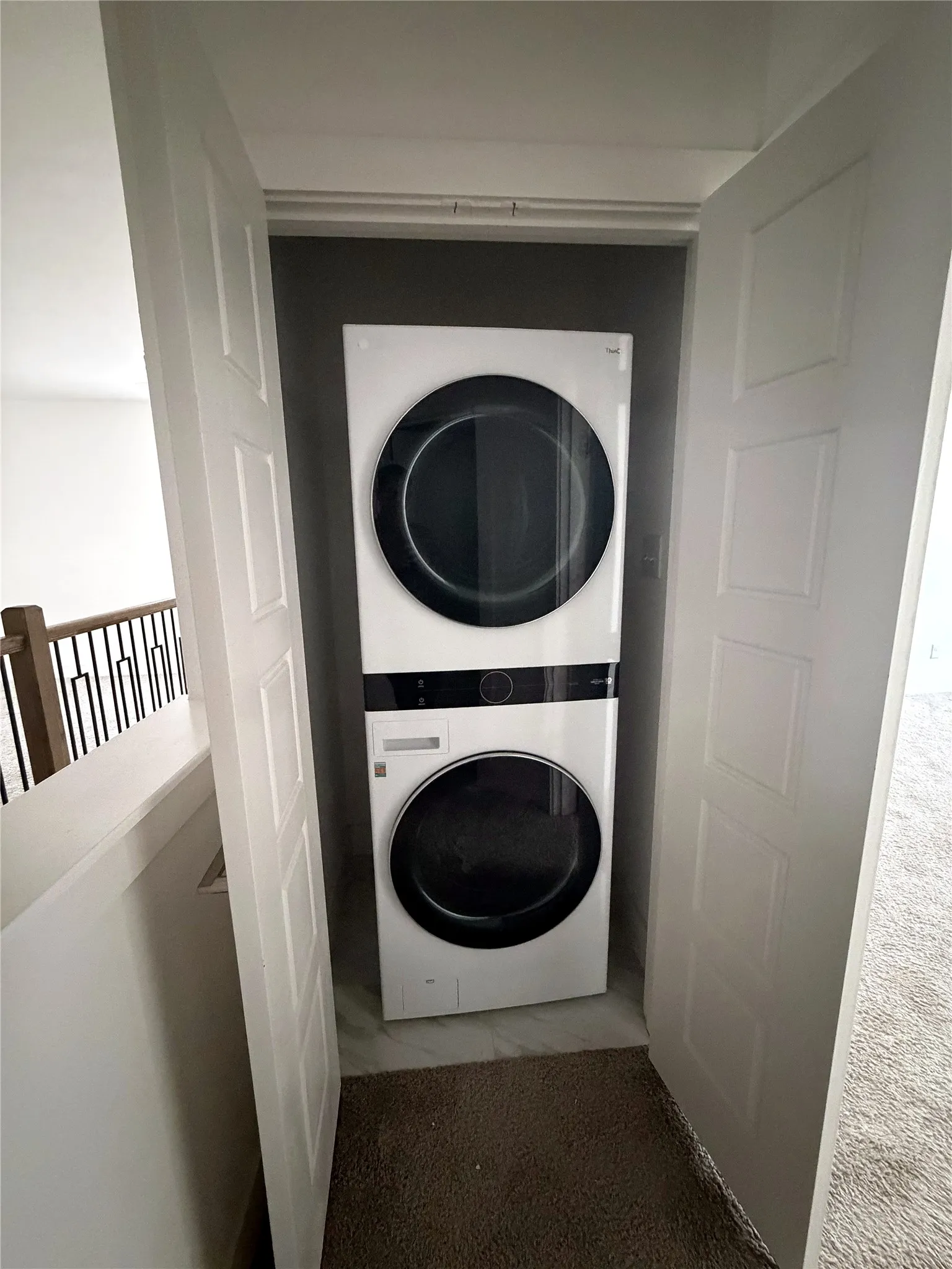 Stackable laundry center within a dedicated closet