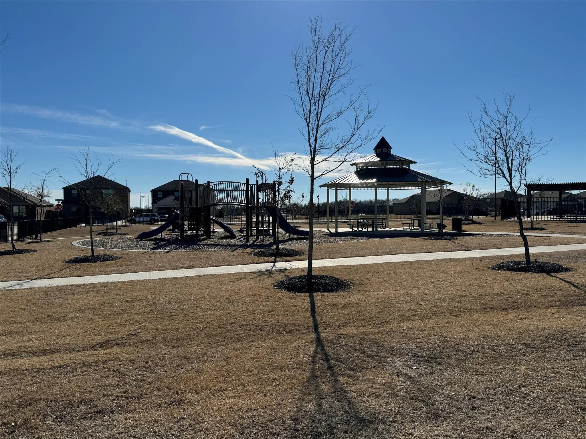 Community jungle gym featuring a gazebo and a patio