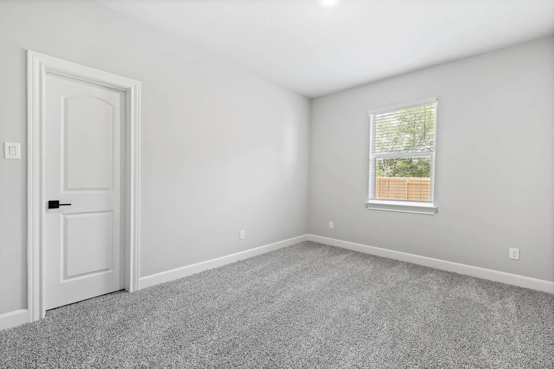 Unfurnished room with baseboards and carpet floors