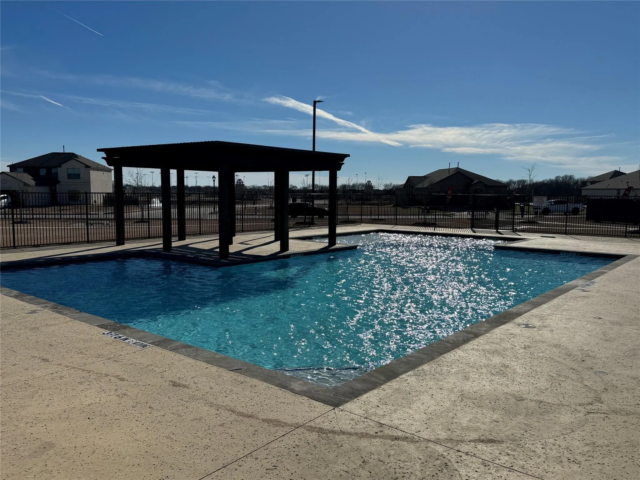 Community pool featuring a patio area