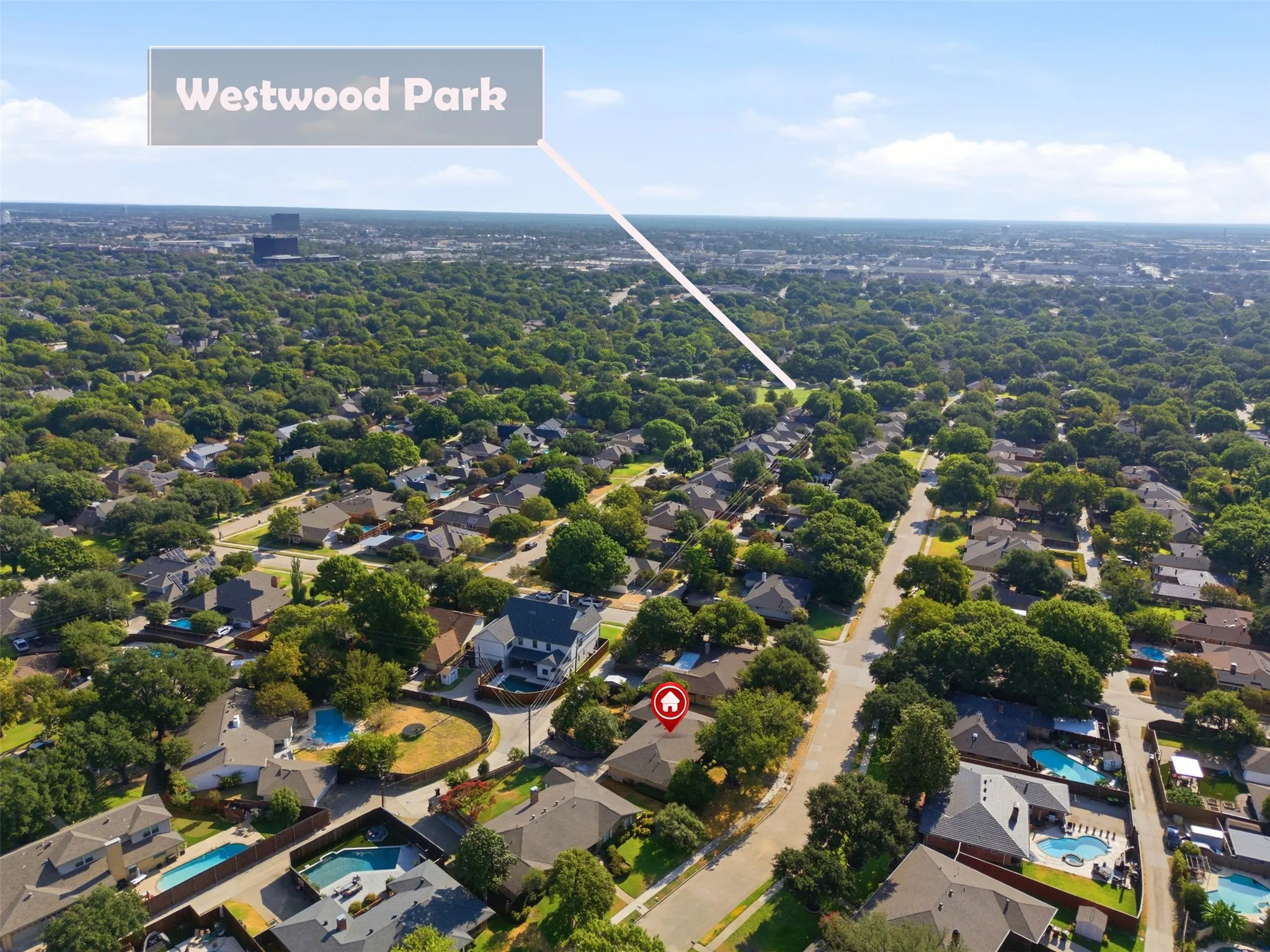 Aerial perspective highlighting the property within a tree-lined residential area