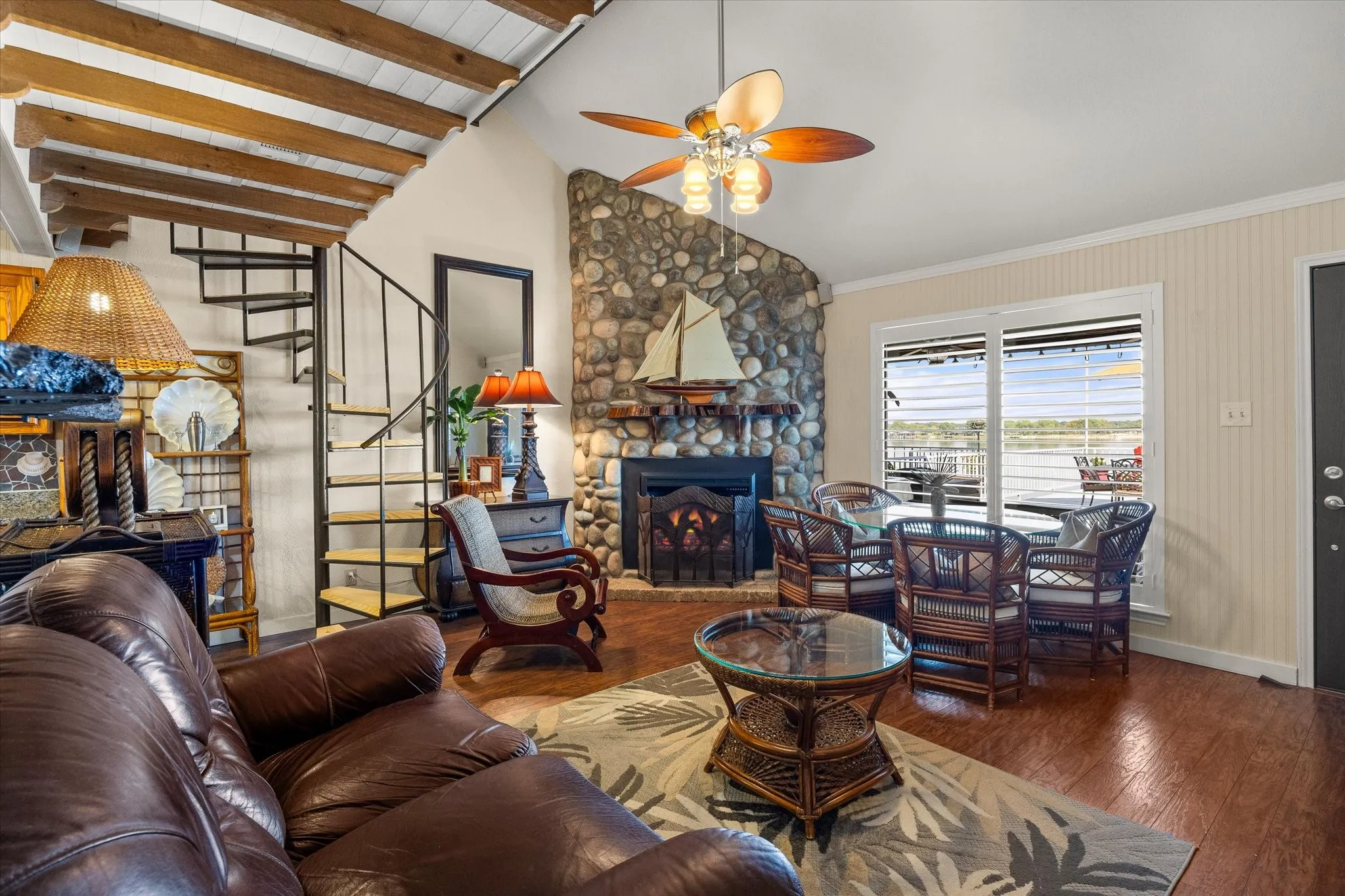 Living Room, with fireplace and staircase leading to 2nd Bedroom