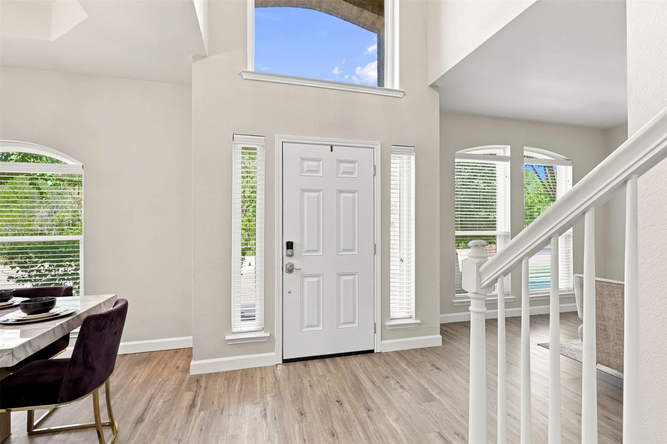 The entry area opens to the dining room and additional living room or flex space.