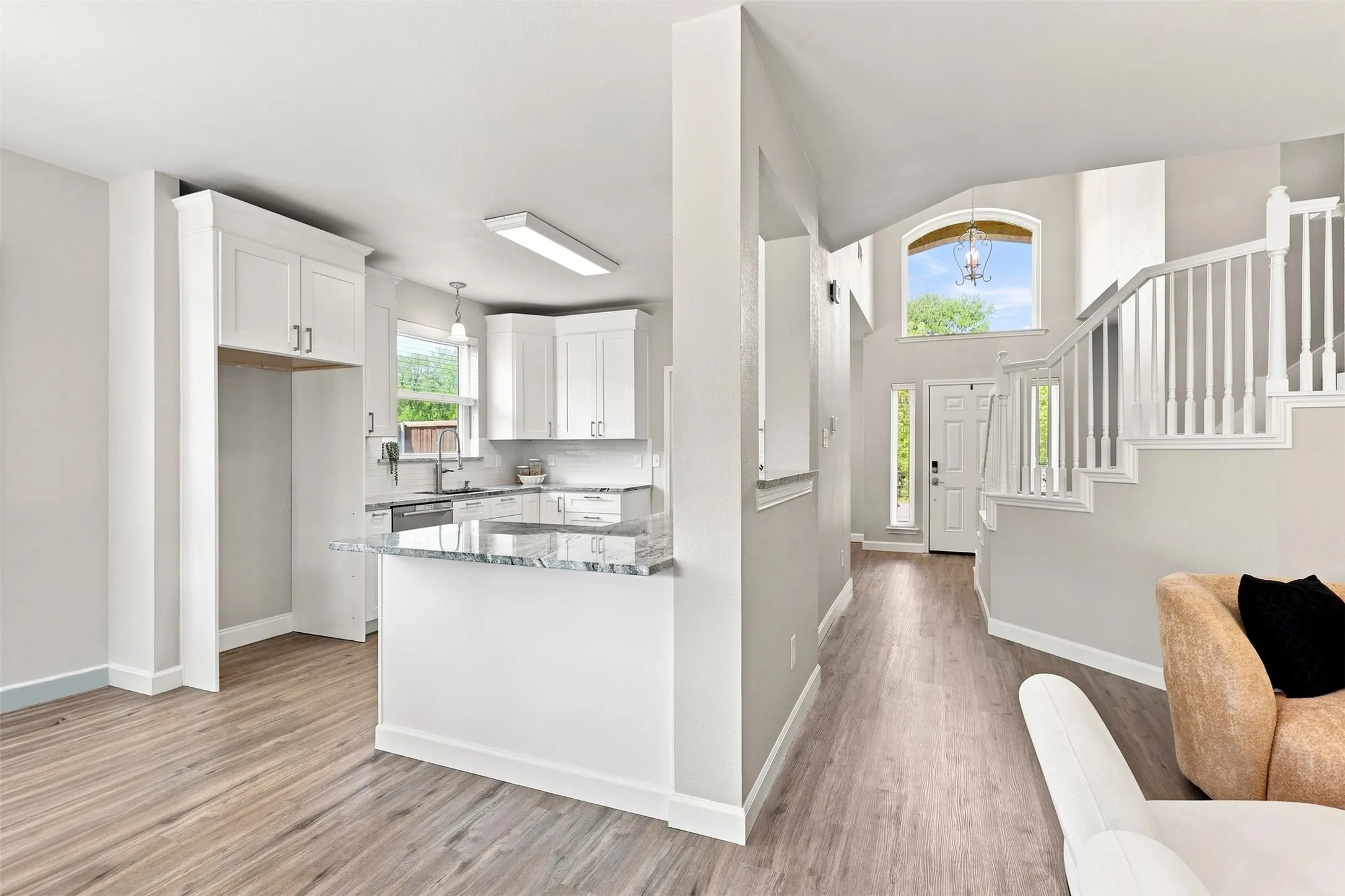 Kitchen flows seamlessly to the living room for ease of entertaining.