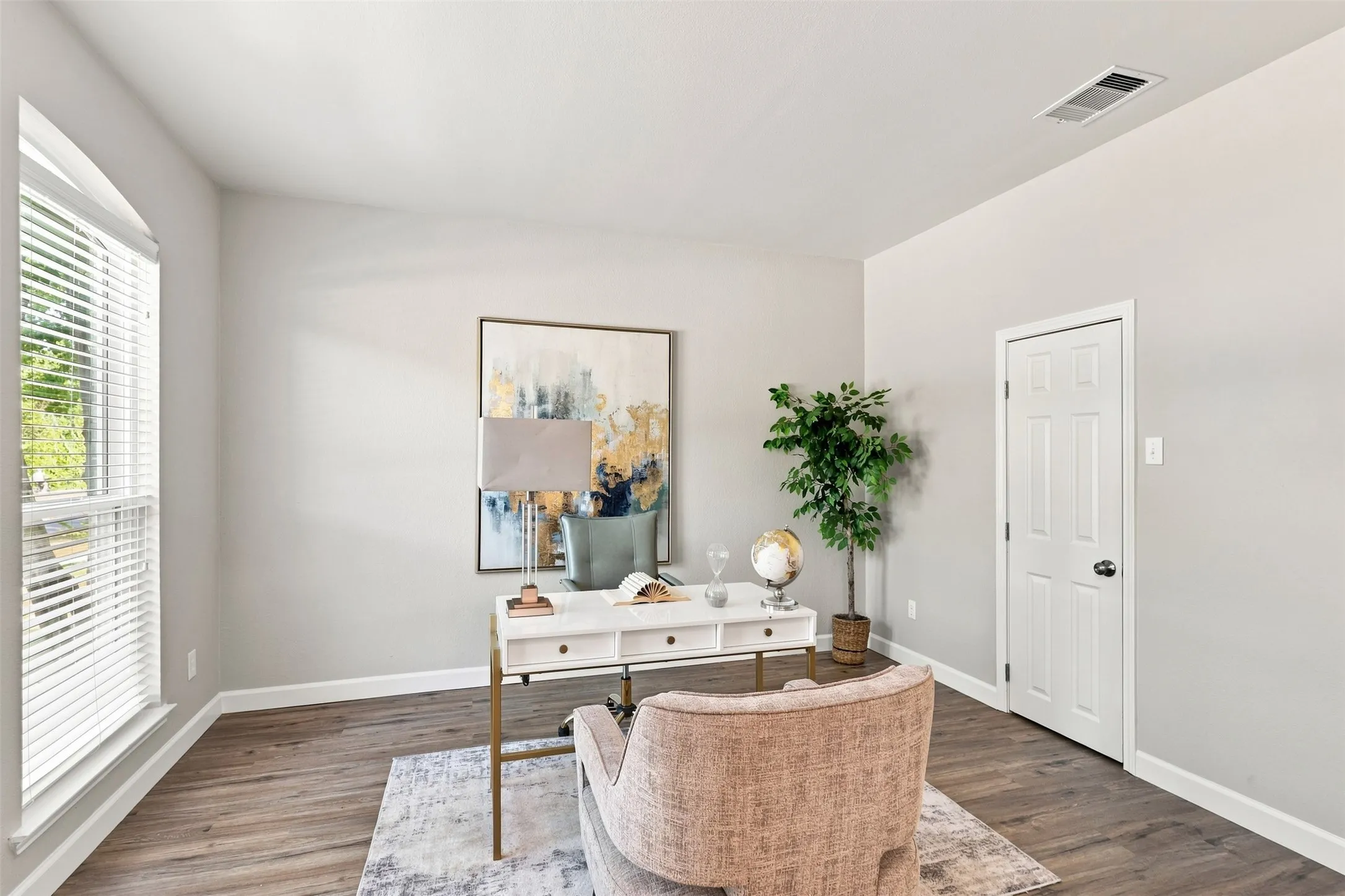 Flex space off of entry is perfect for an office or music room.