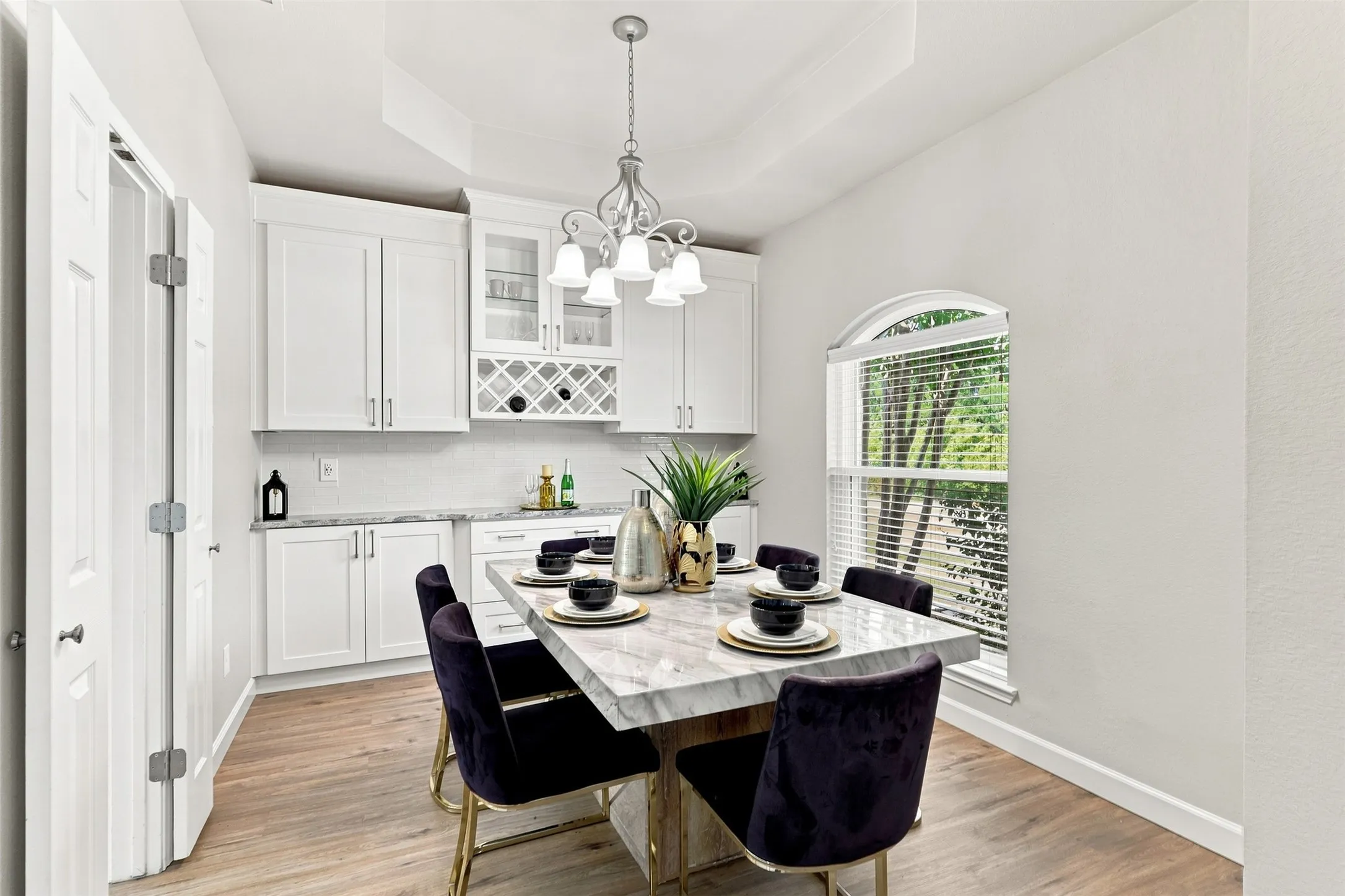 The dining room includes built-in buffet with storage space and granite countertops.