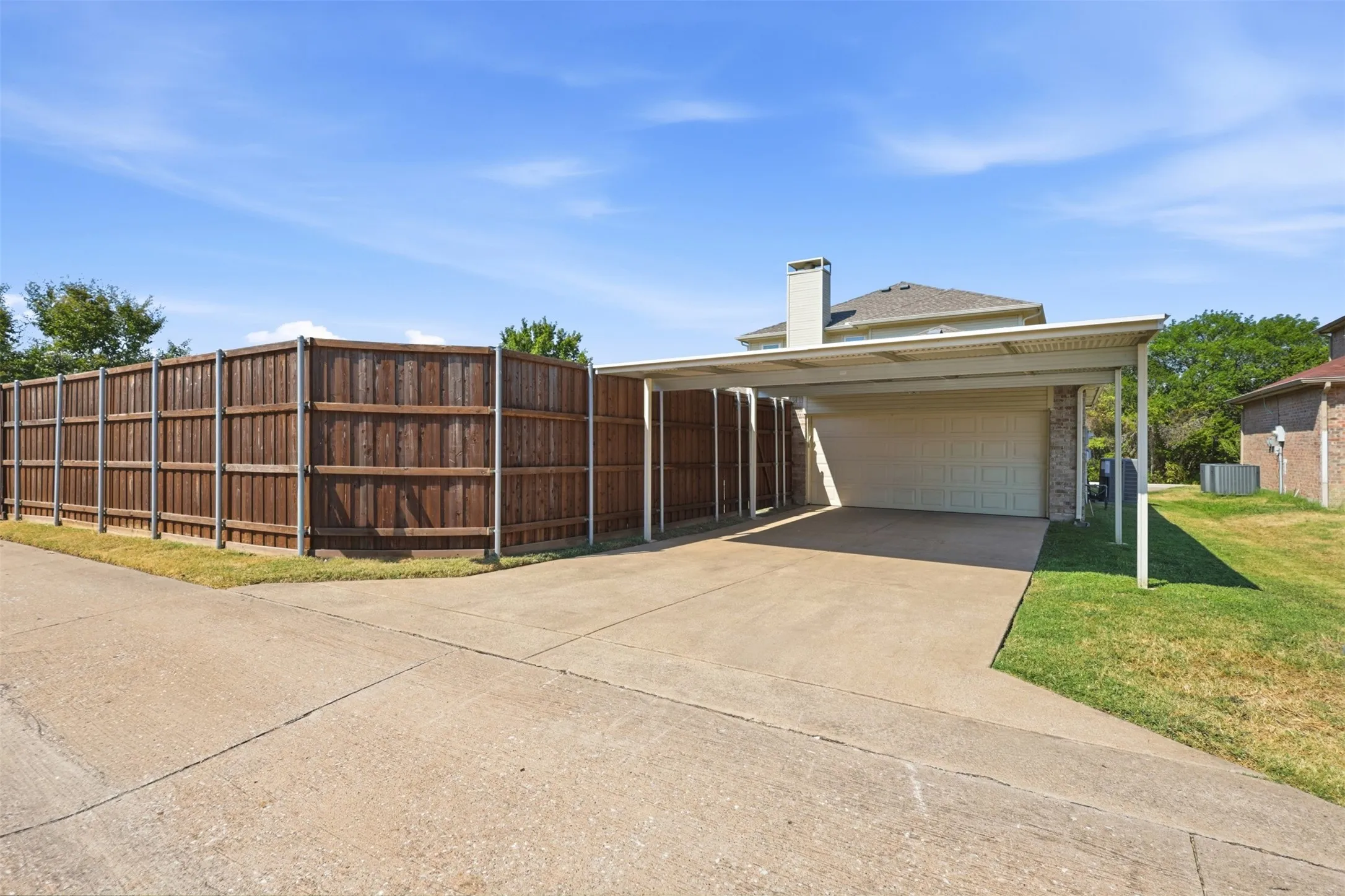Large Carport allows for extra covered parking.