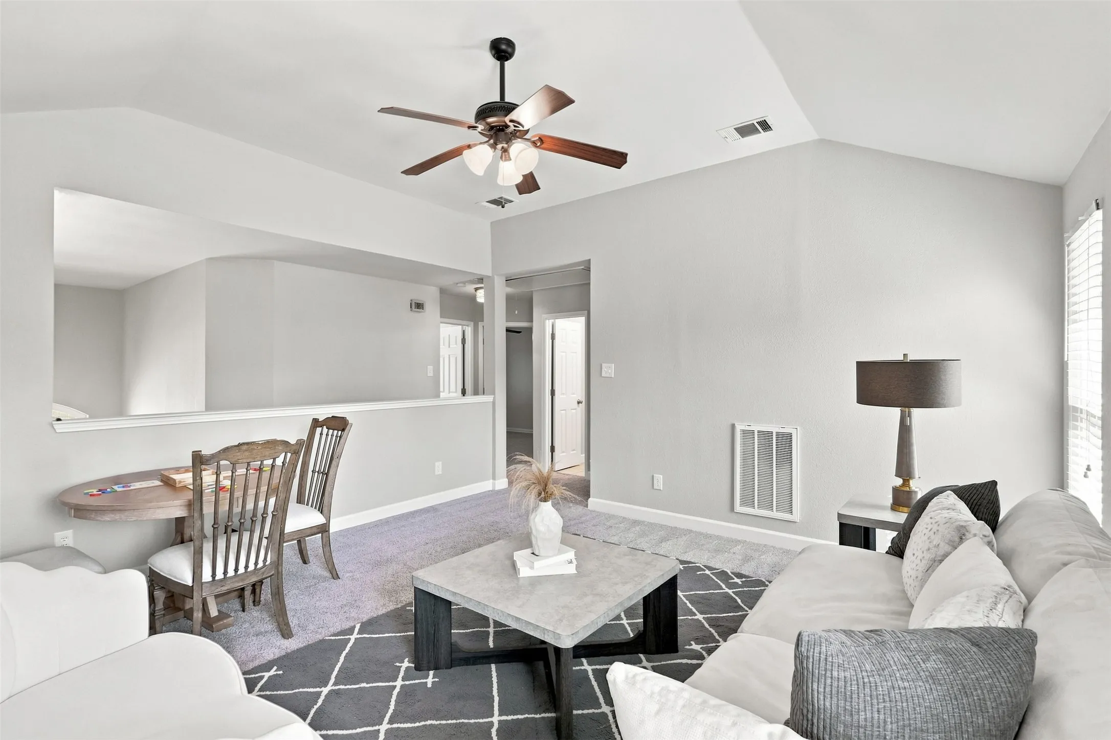 Alternate view of family room looking towards stairs and additional bedrooms.