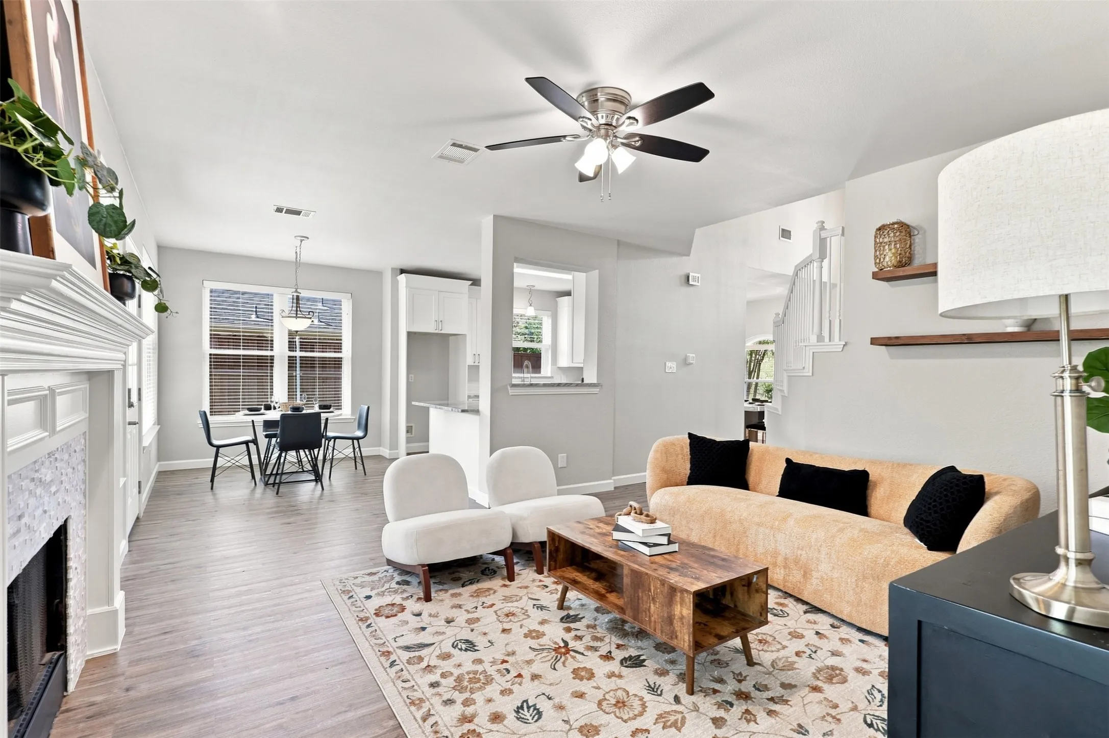 The open concept with multiple windows makes the space feel open and bright while still maintaining the cozy feel.