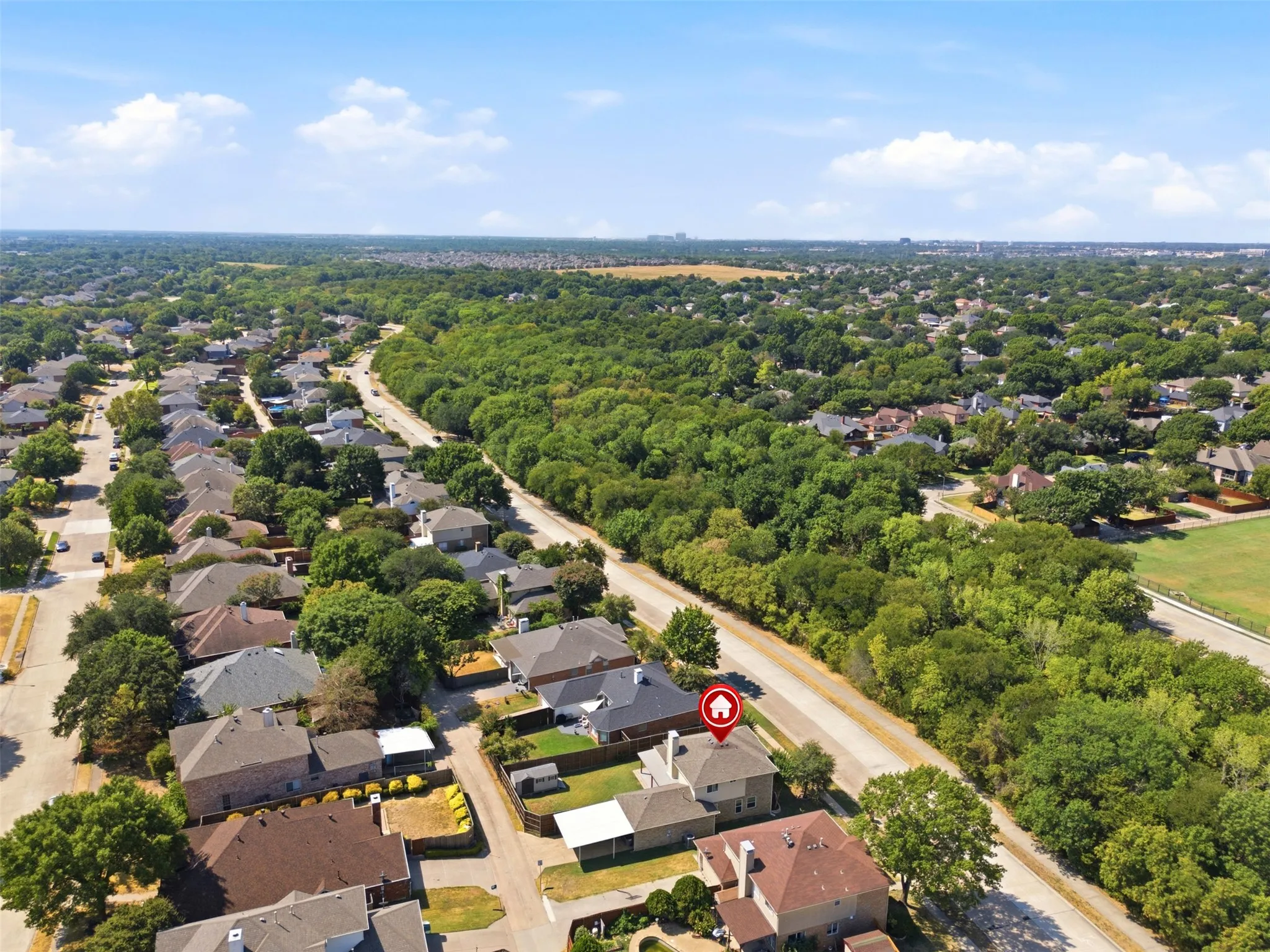 Established neighborhood setting with ample green space and walking trails across the street.