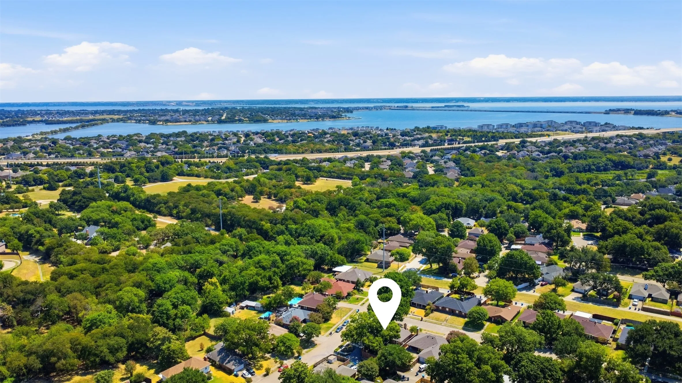 Expansive neighborhood with mature trees and established residential properties