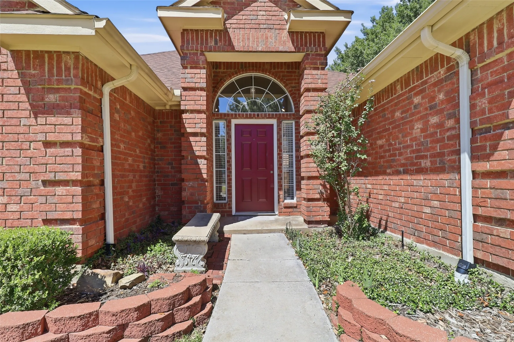 front porch with arch window above door