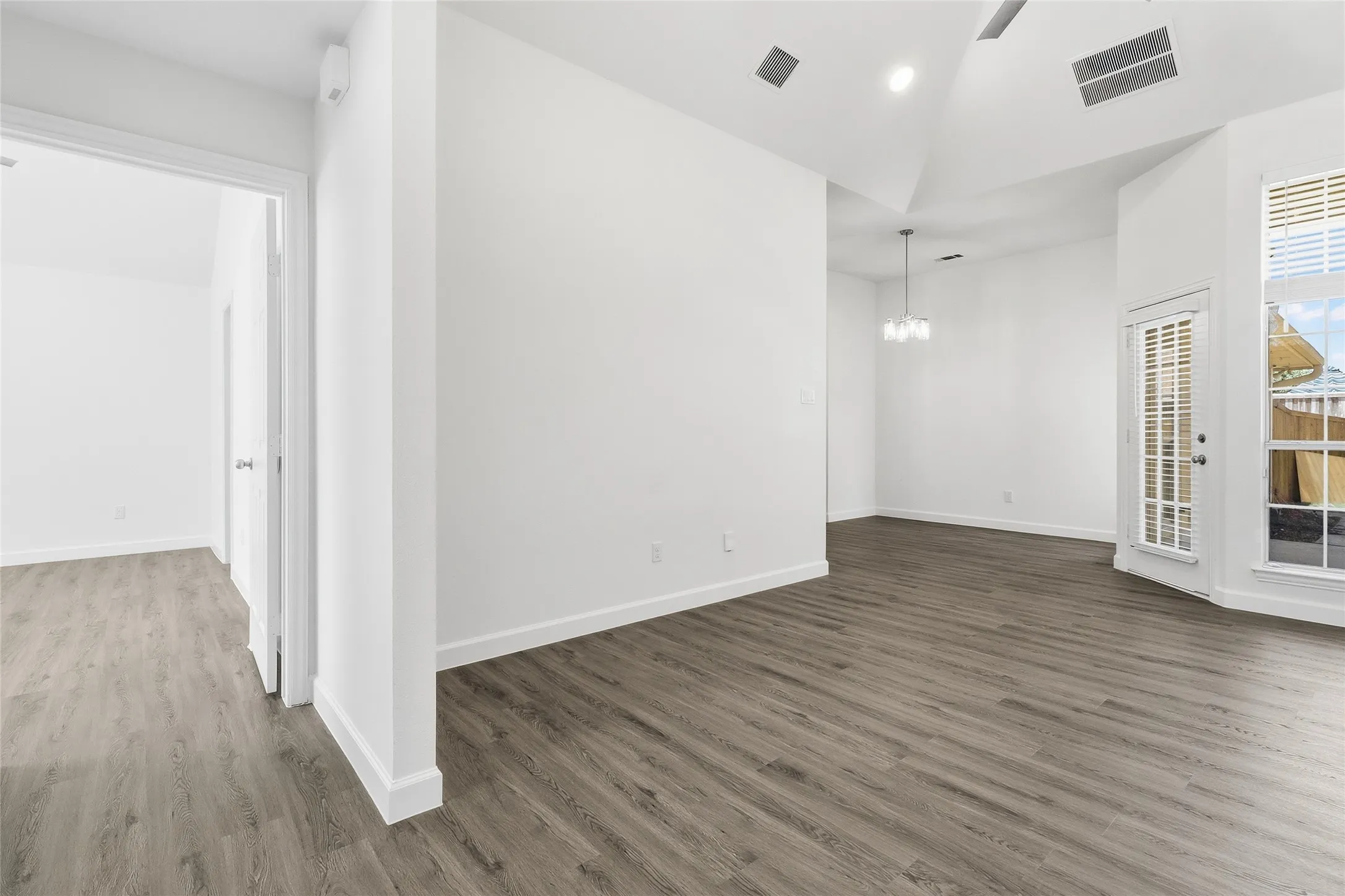 Living room/entry with primary bedroom to your left