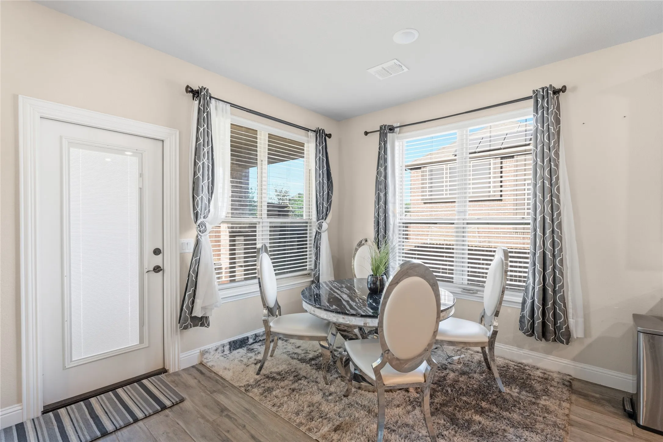 Dining room featuring light wood finished floors and baseboards