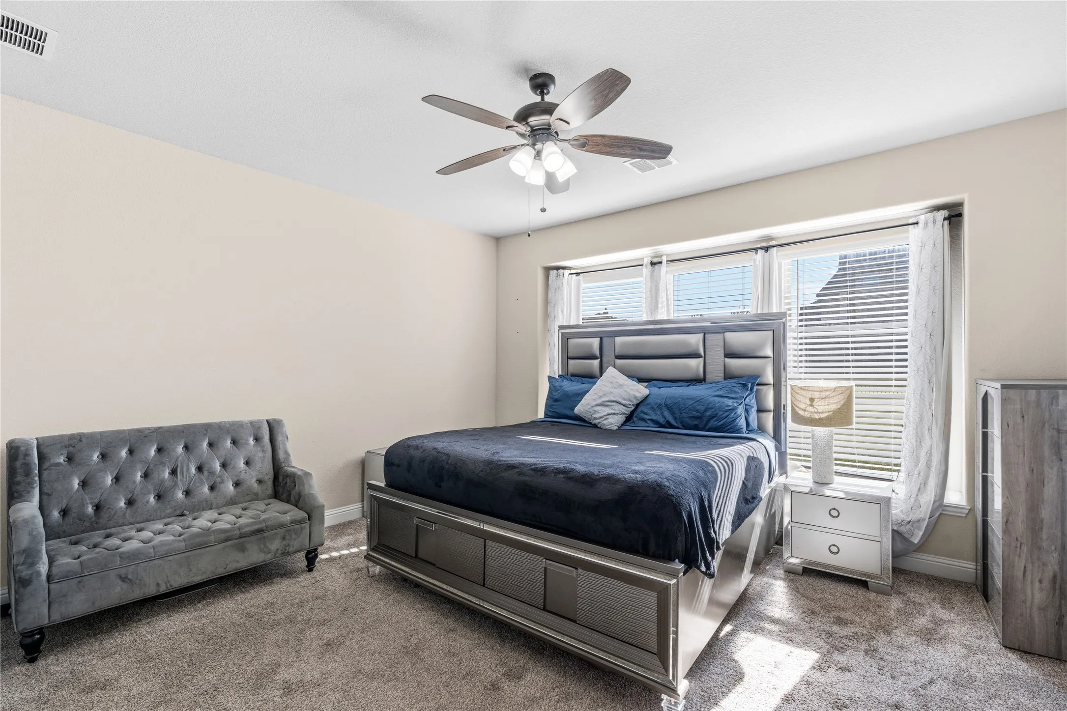 Bedroom featuring carpet floors and ceiling fan