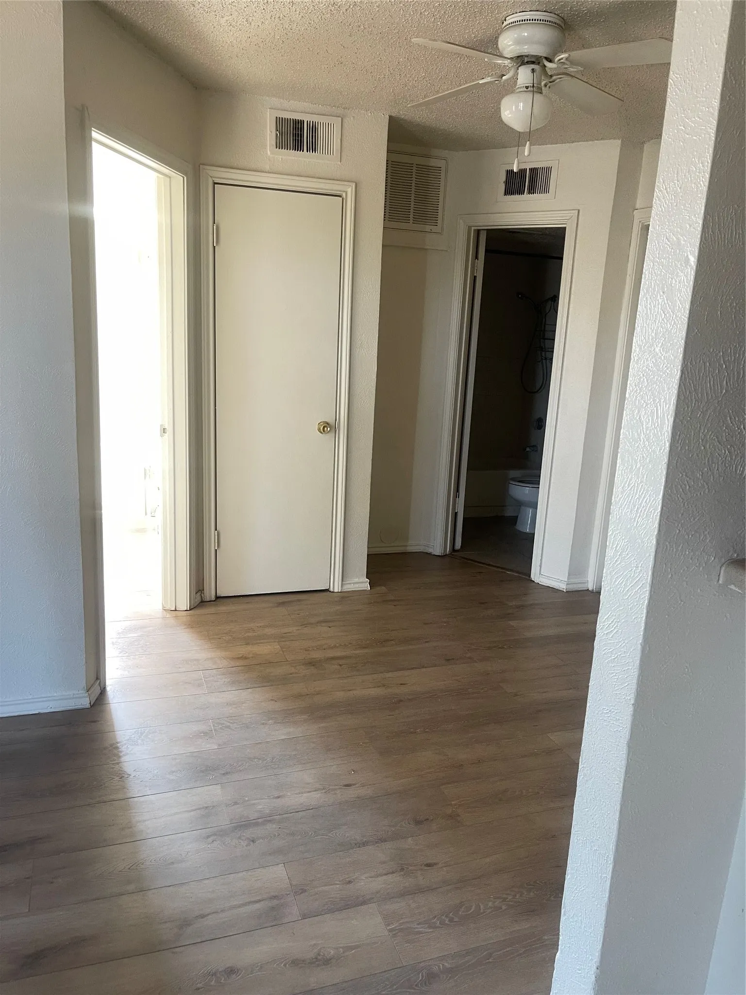 Hallway to bathroom and bedrm