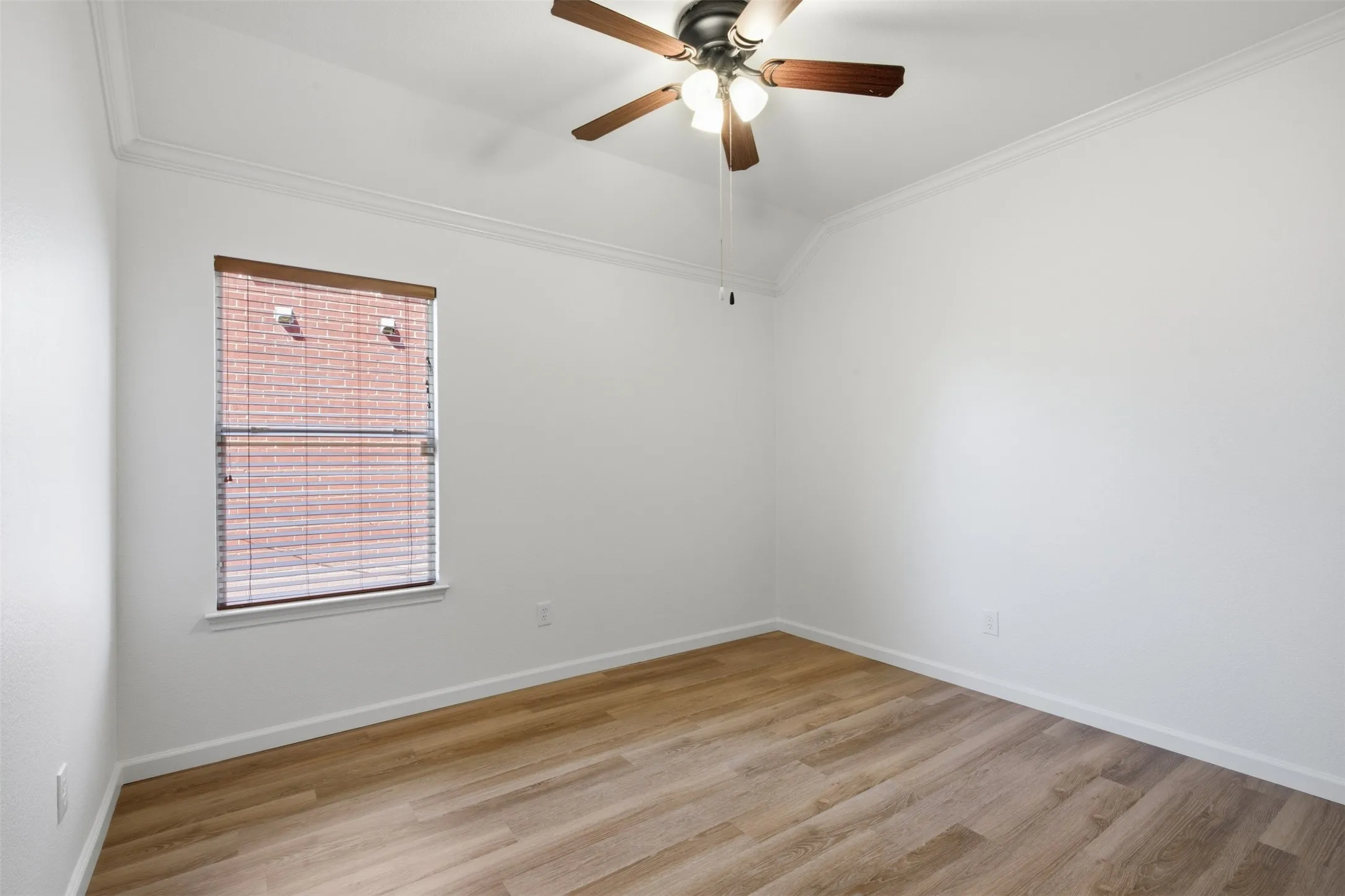 Bedroom #3 with luxury vinyl plank, window coverings and fresh paint at 10232 Ash Creek Lane by Seth Fowler of Williams Trew Real Estate