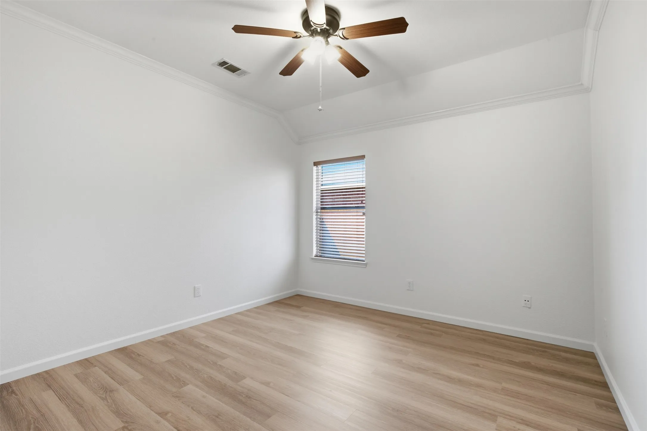 Bedroom #2 with luxury vinyl plank, window coverings and fresh paint at 10232 Ash Creek Lane by Seth Fowler of Williams Trew Real Estate