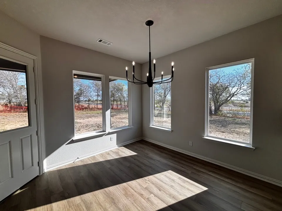 Wood-finish flooring with light neutral walls