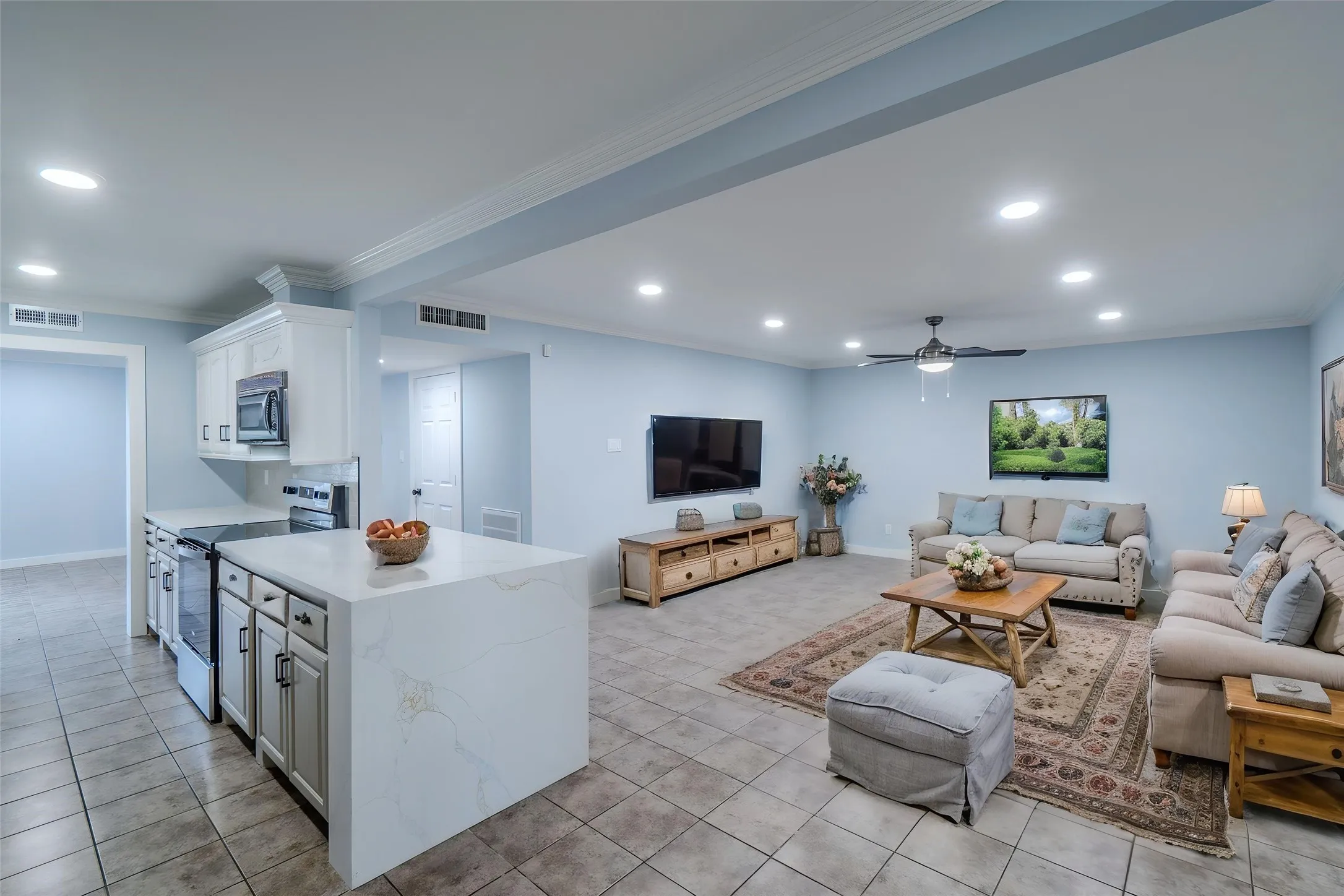 Virtually Staged-Open-concept living area with recessed lighting, crown molding, a ceiling fan, and tile flooring