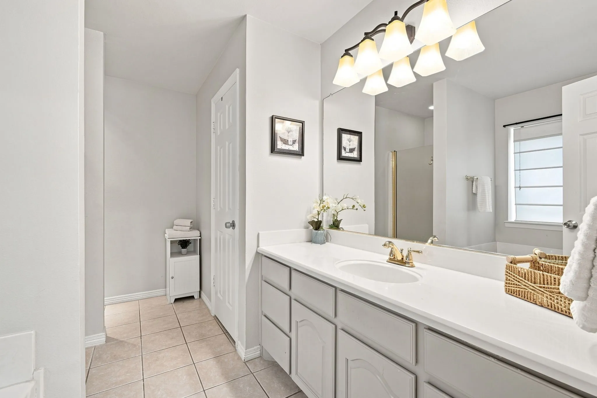 Your ensuite bath hosts a large vanity with storage, garden tub, separate shower and walk-in closet
