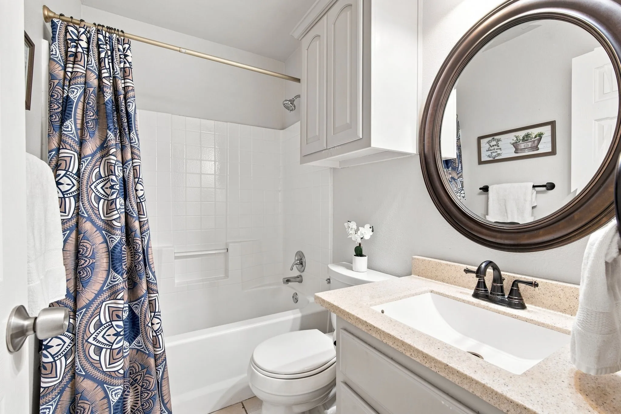 Two secondary bedrooms share an updated full bath with plenty of storage areas for all