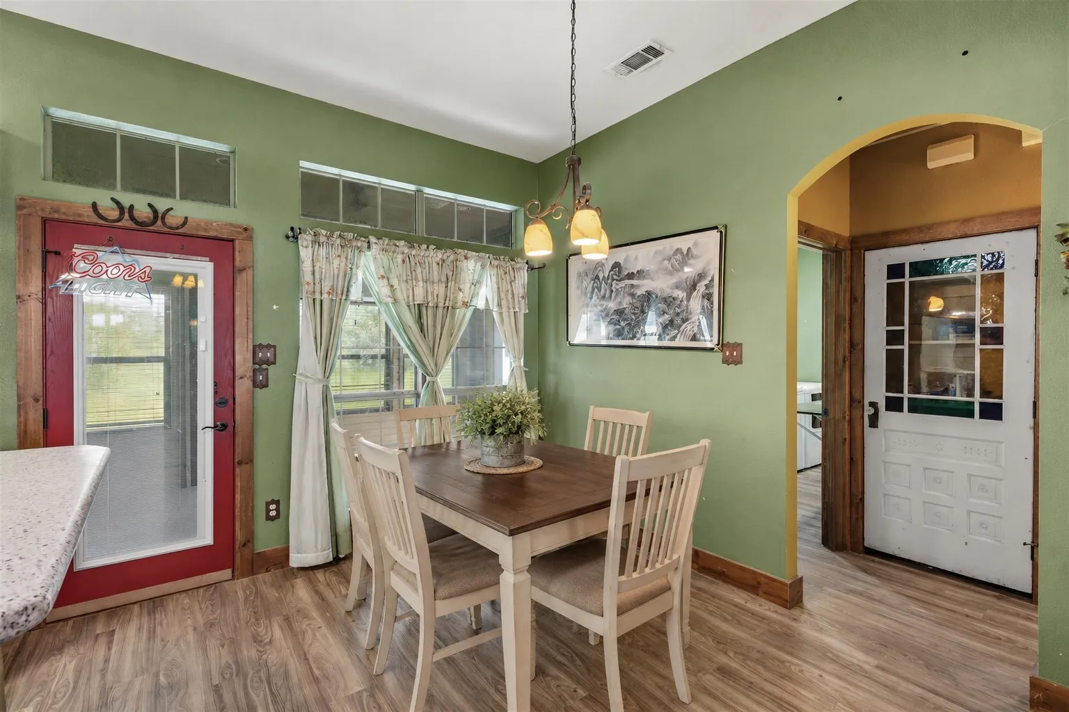 Dining area has been virtually staged