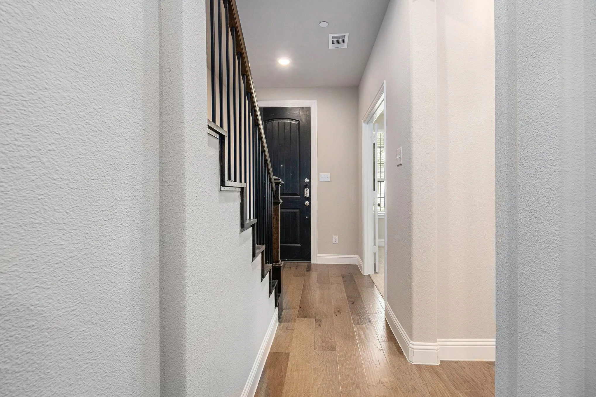 Wood-finish flooring throughout the entryway