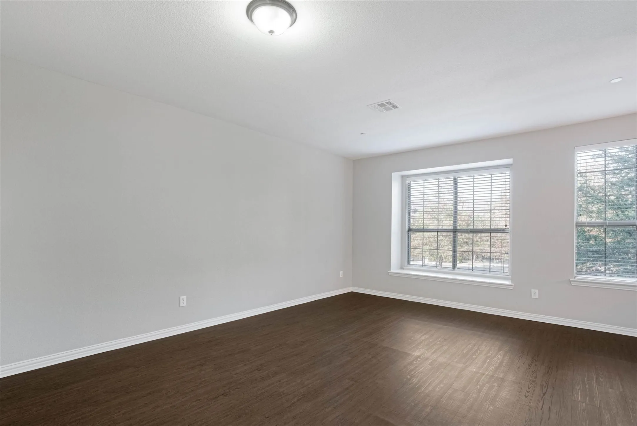 Large downstairs den would make a great home office, gym, or guest room