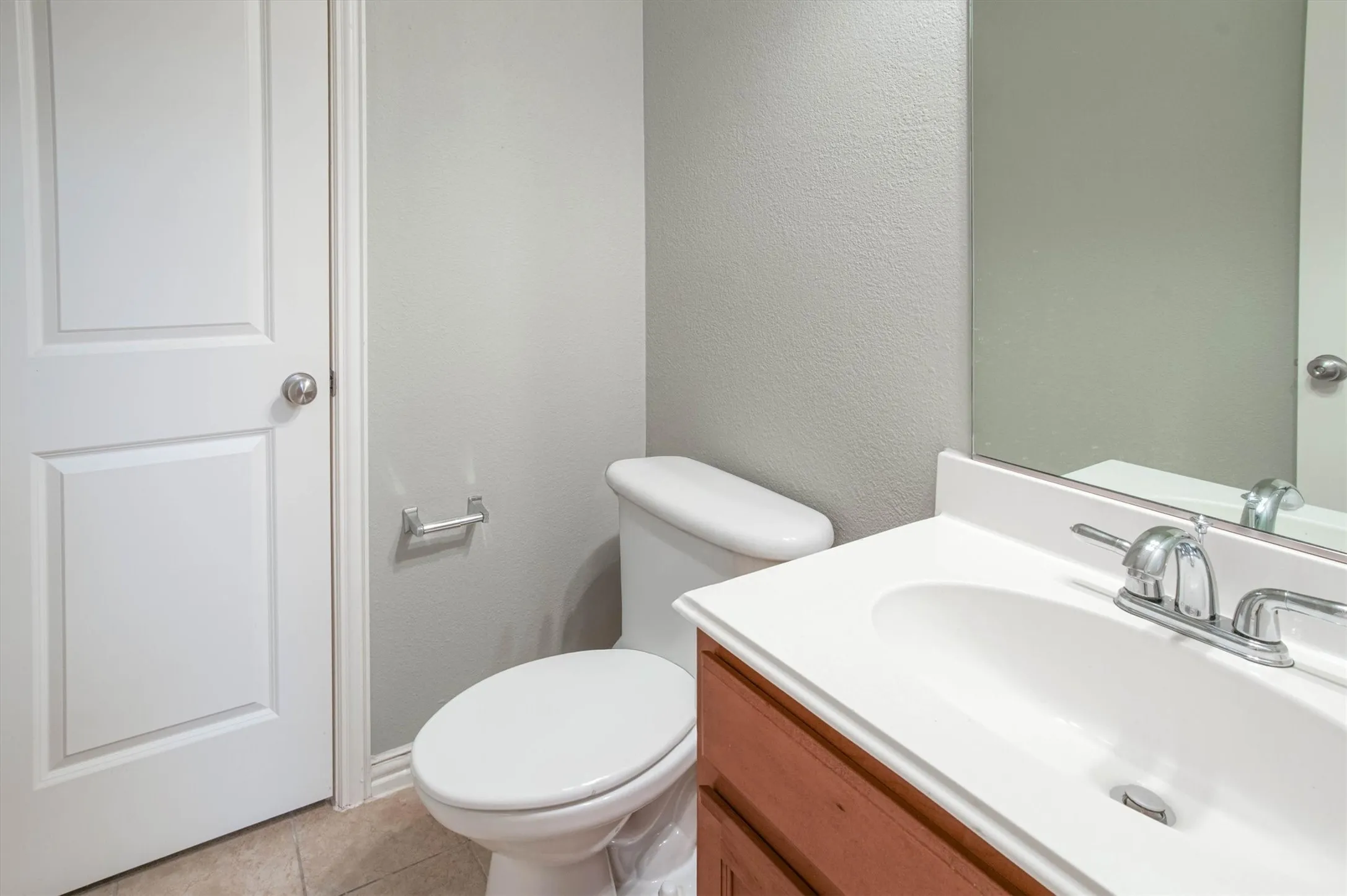 Half bathroom off downstairs den