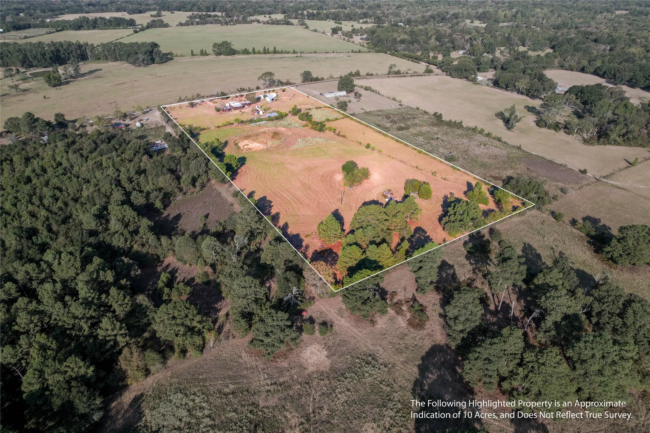 Expansive undeveloped land featuring mature trees and open fields