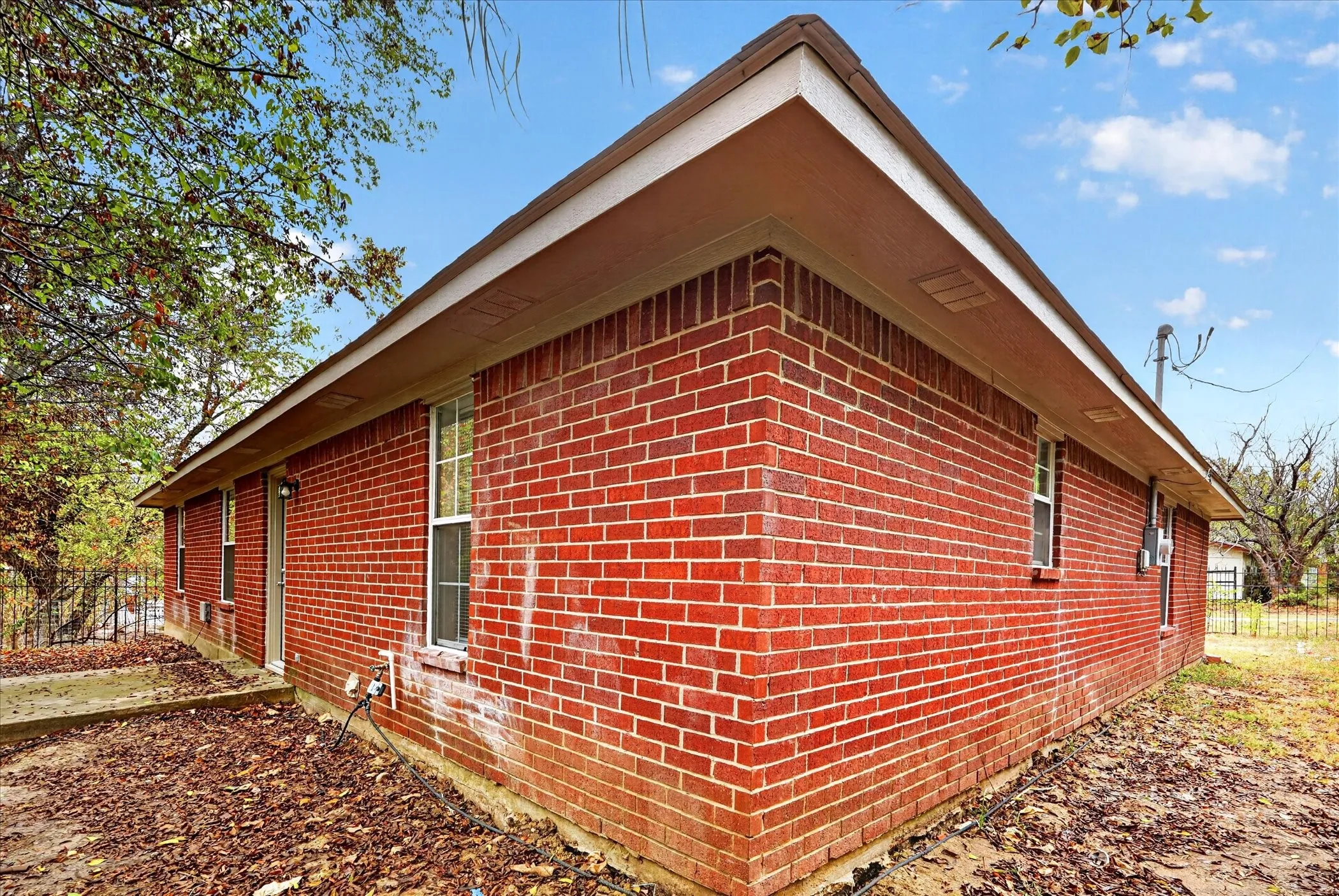Red brick exterior with white trim