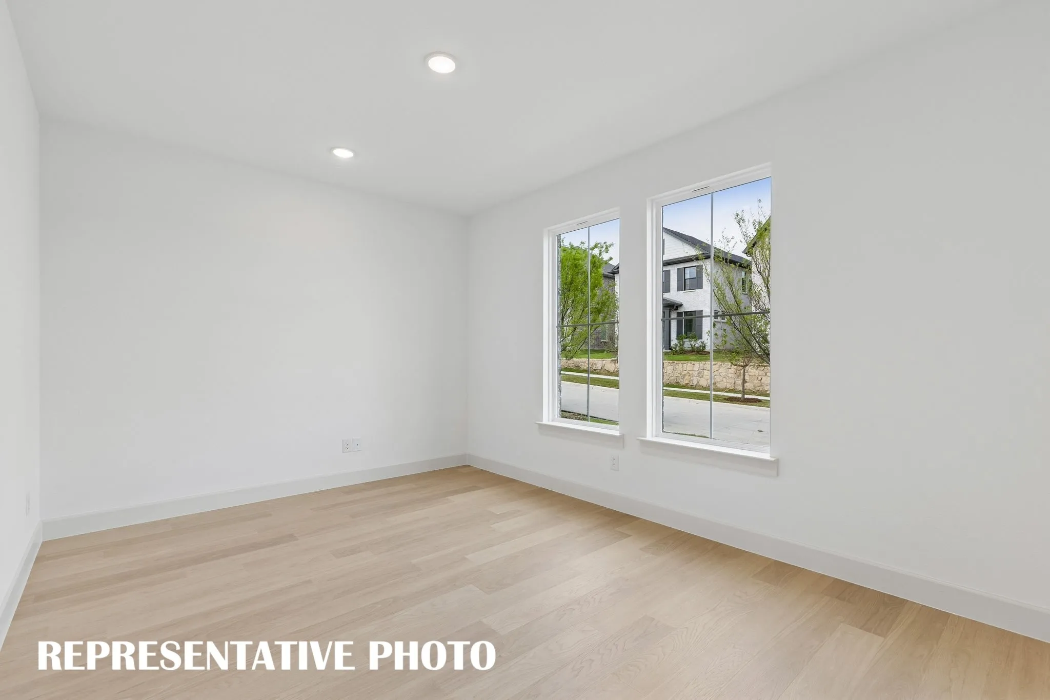 For the professional needing to work from home, our Louis plan offers a spacious light filled home office just off the main entry.  REPRESENTATIVE PHOTO