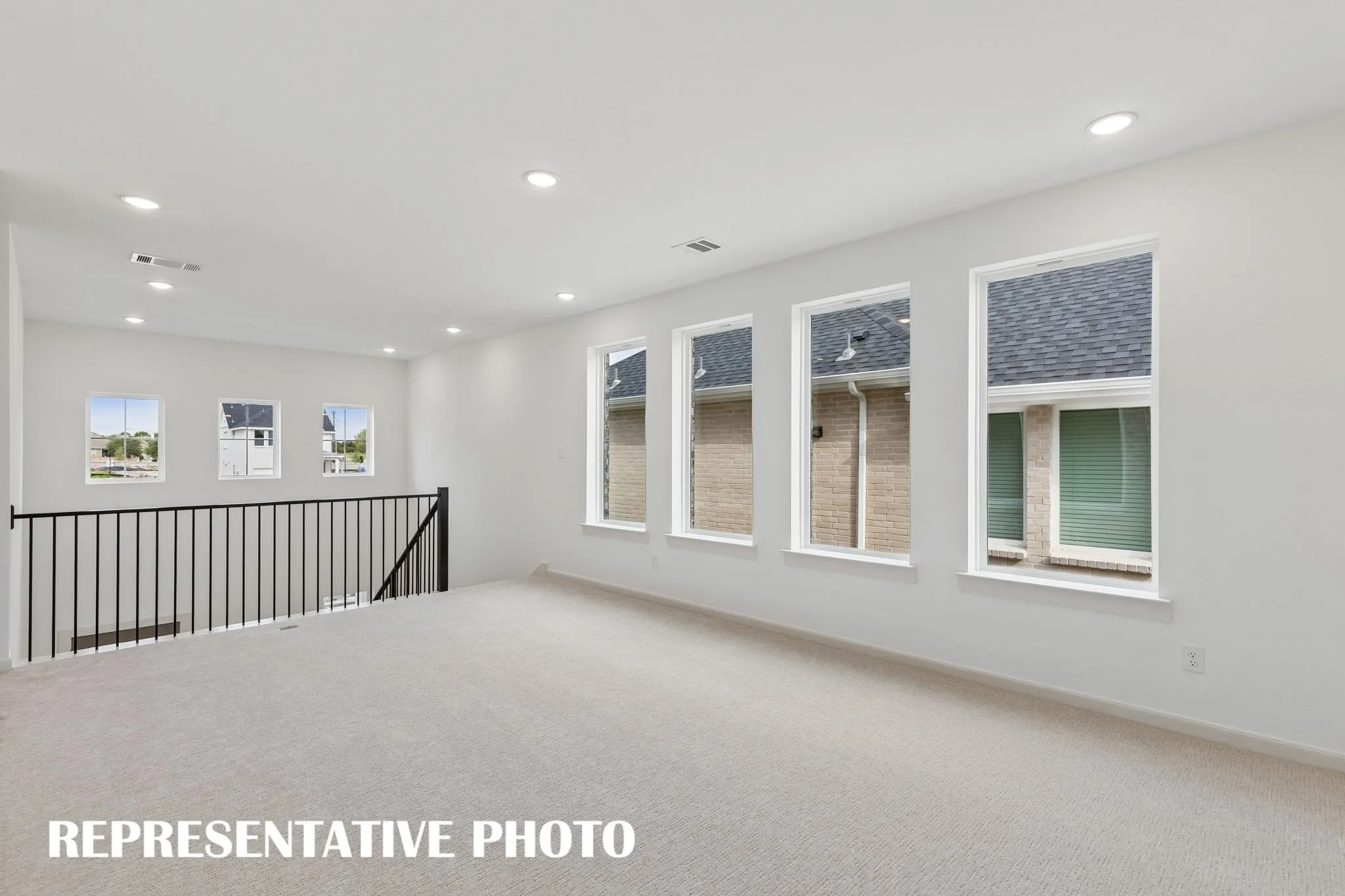 Light, bright and spacious, you'll love hosting family game night or big game day parties in this wonderful game room!  REPRESENTATIVE PHOTO