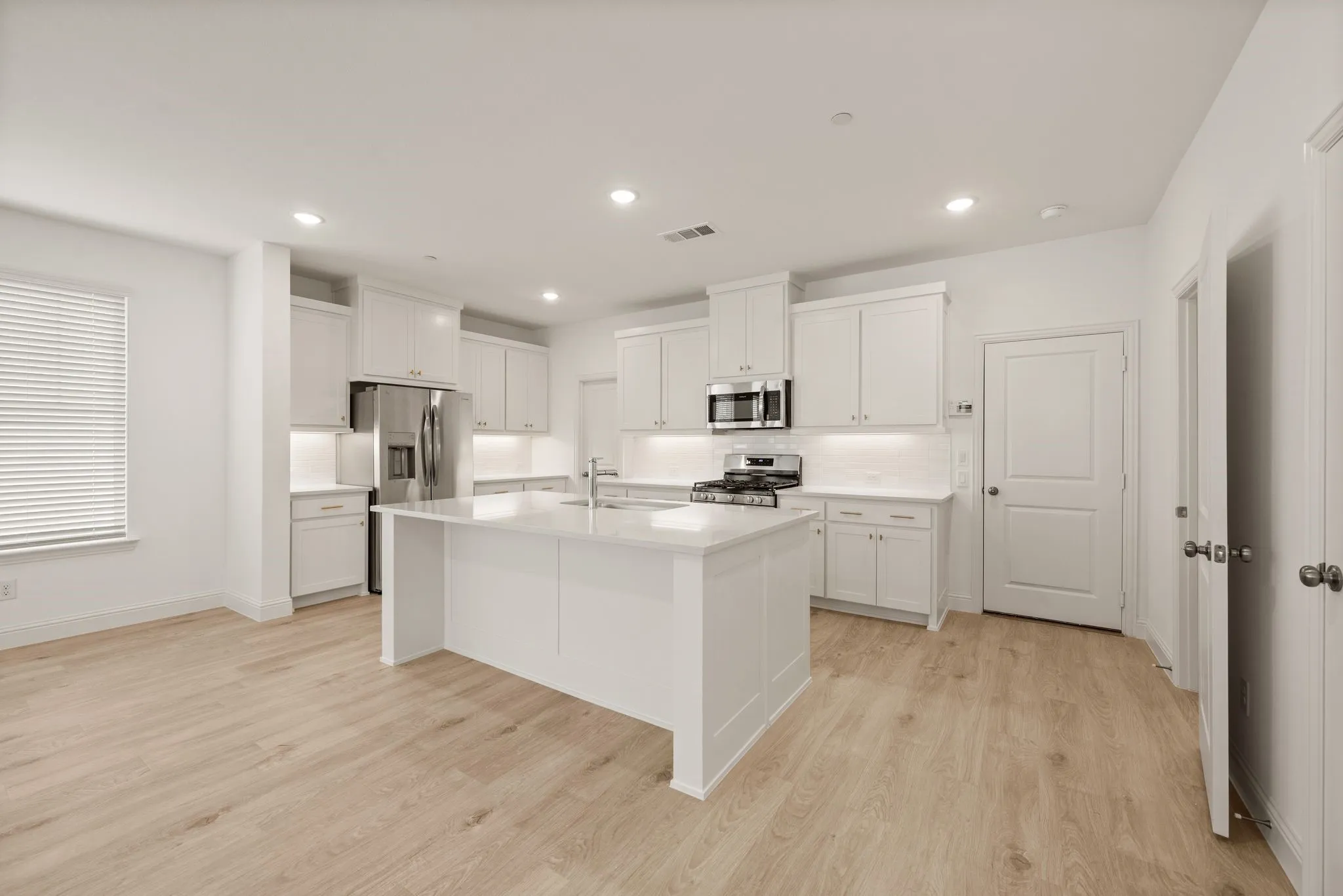 View of Kitchen with undercabinet lighting and large pantry
