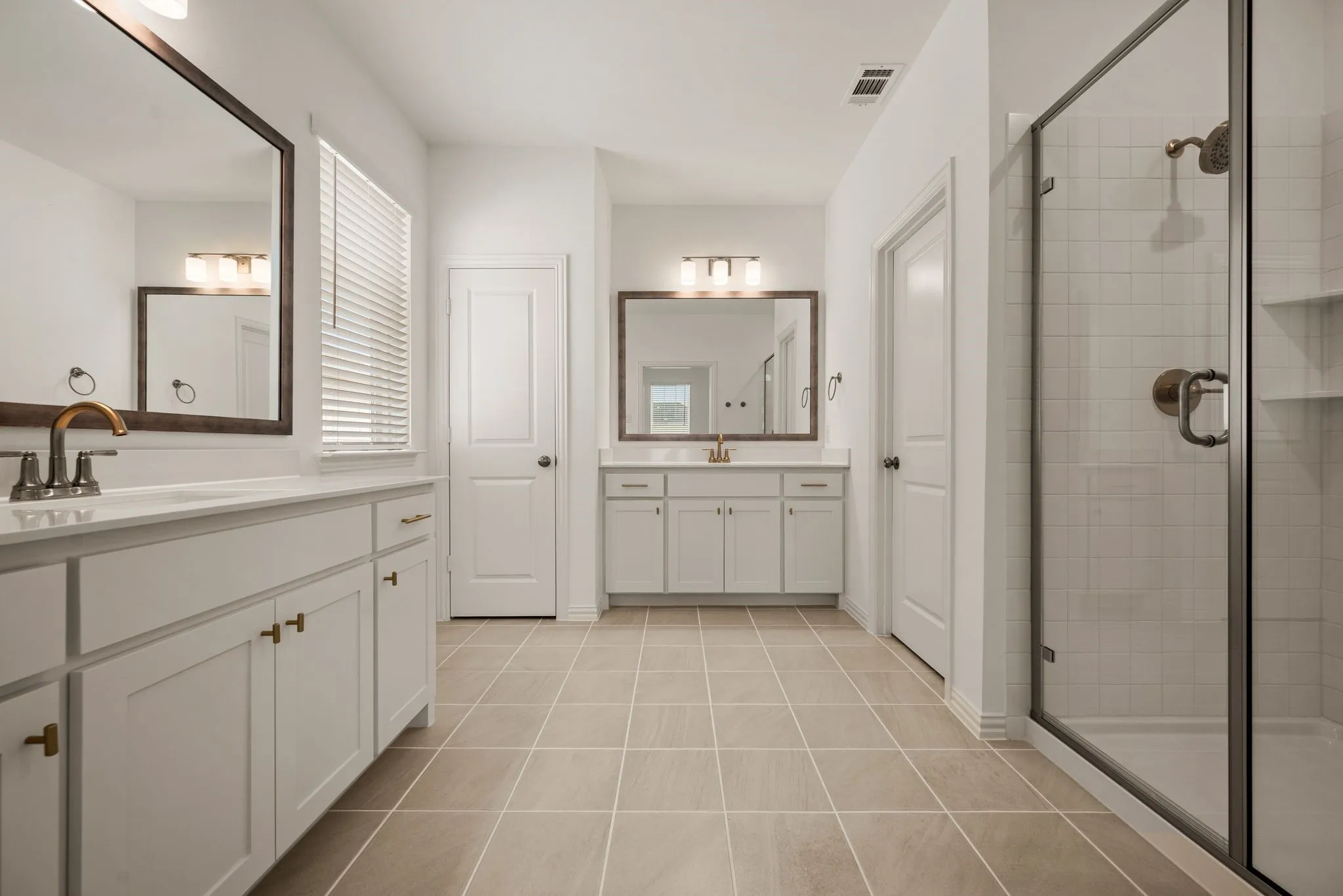 Separate sinks and vanities,large shower