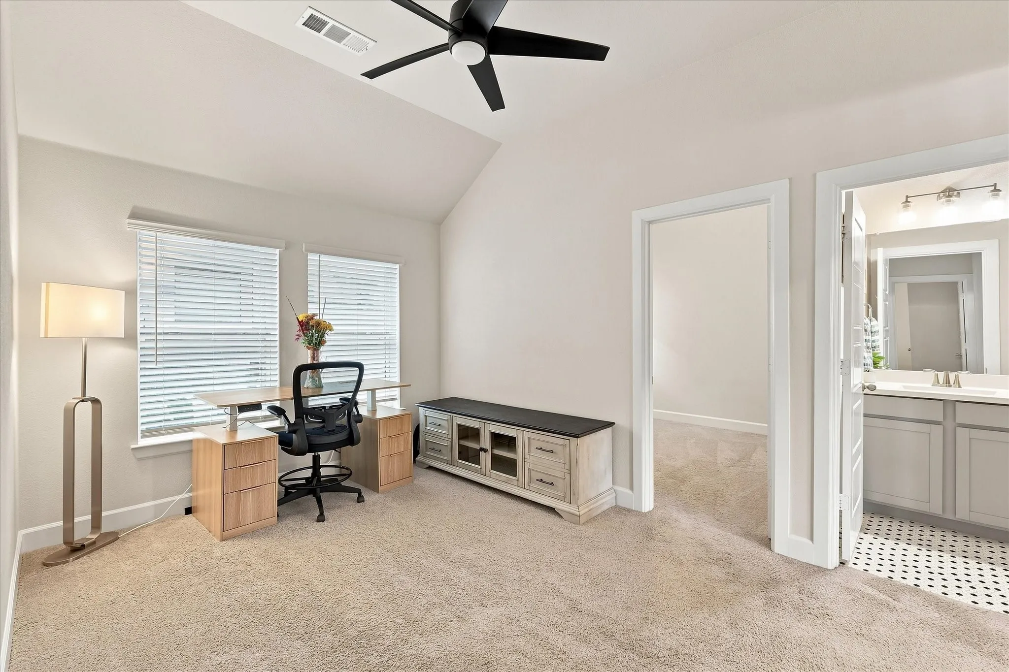 This flex space is situated between two secondary bedrooms and would make a great playroom, school room or gameroom!