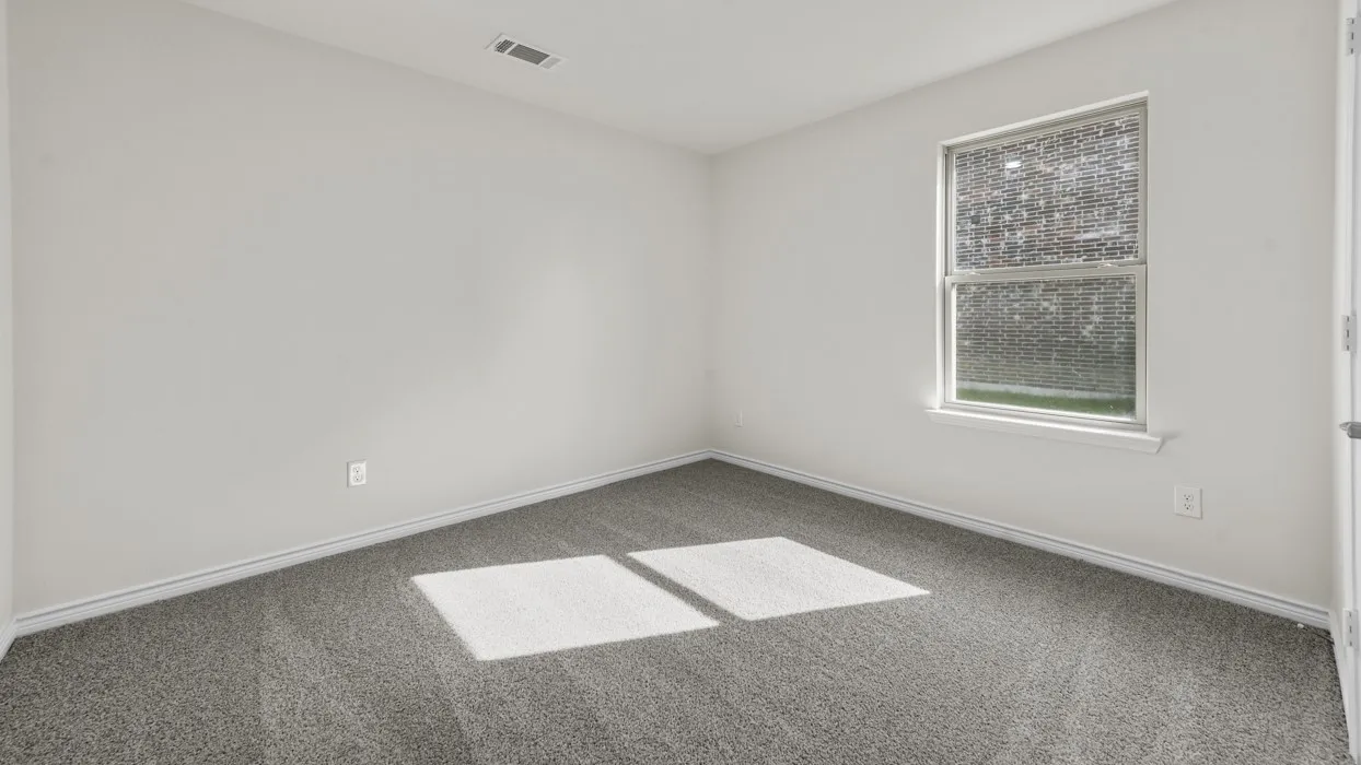 Room featuring light gray walls, gray carpeting, a single window, and white baseboards