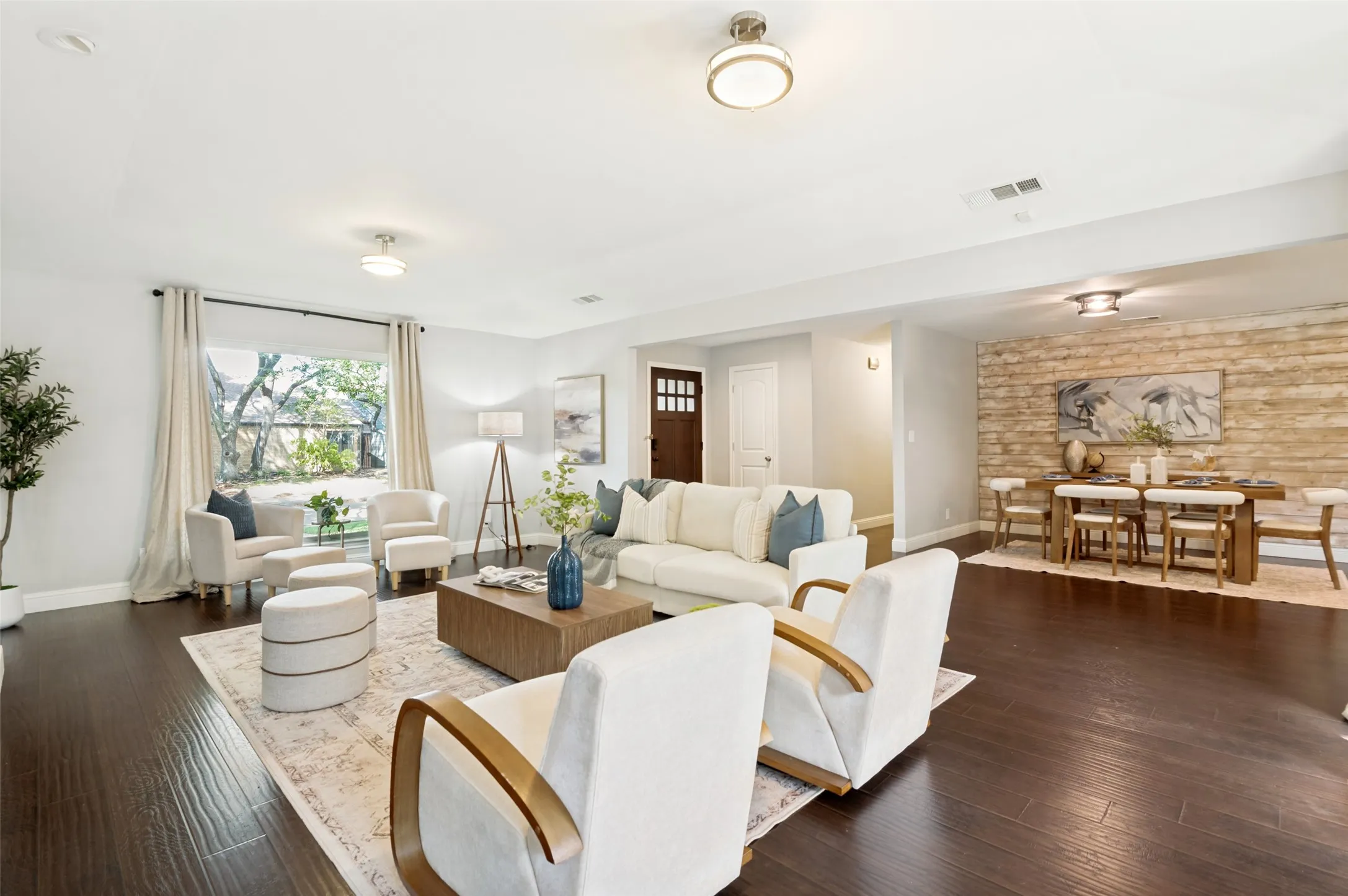Enter into a sea of wood floors and open spaces.