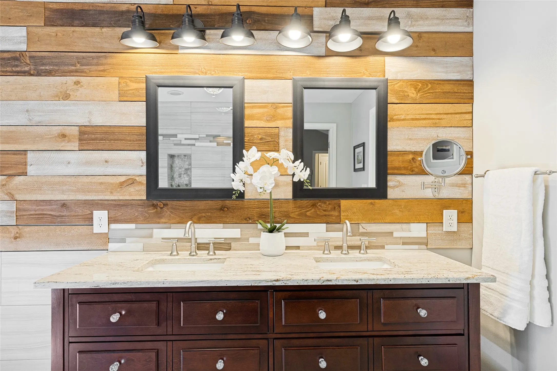 Warm color tones and double vanity set the mood.