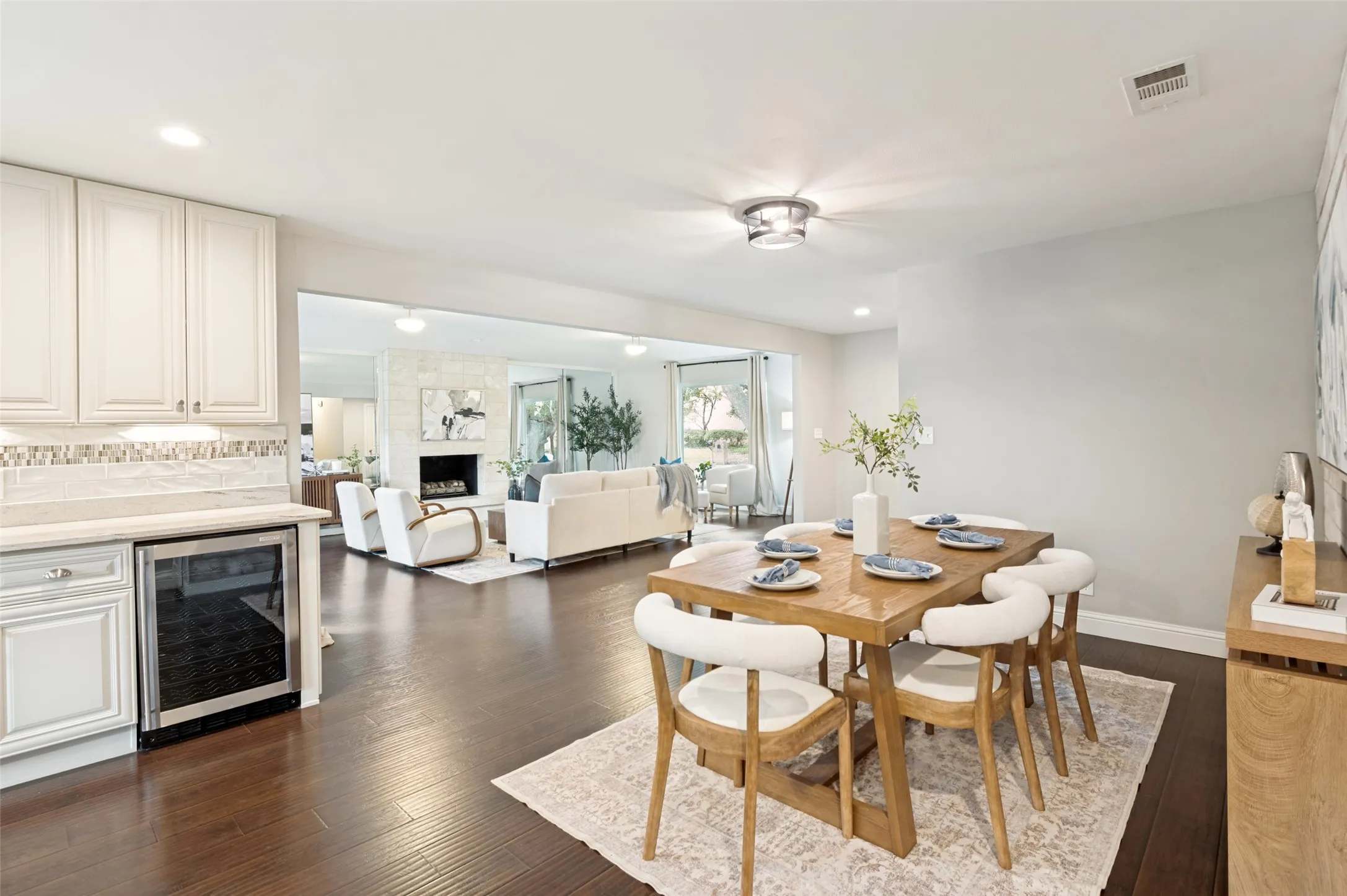 The wood floors and soft neutral colors add warmth.