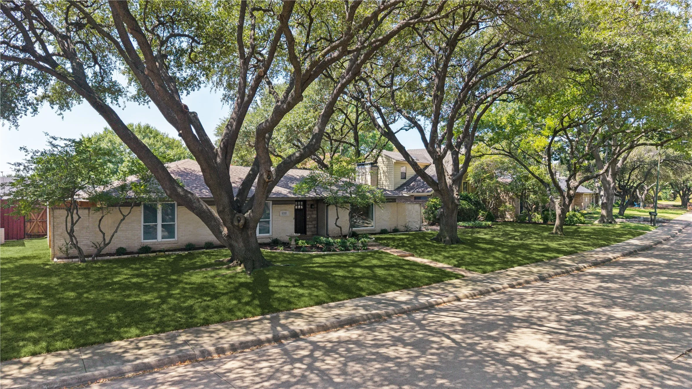 Tree lined street adds neighborhood charm.