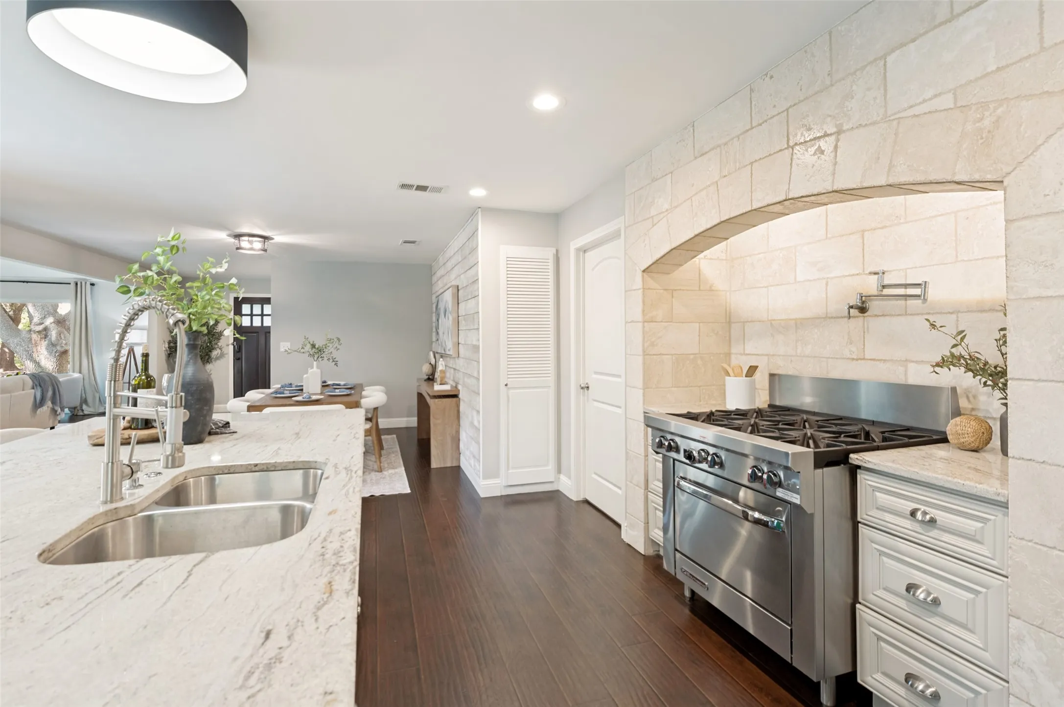 Commercial gas stove with pot filler is a chef's dream.