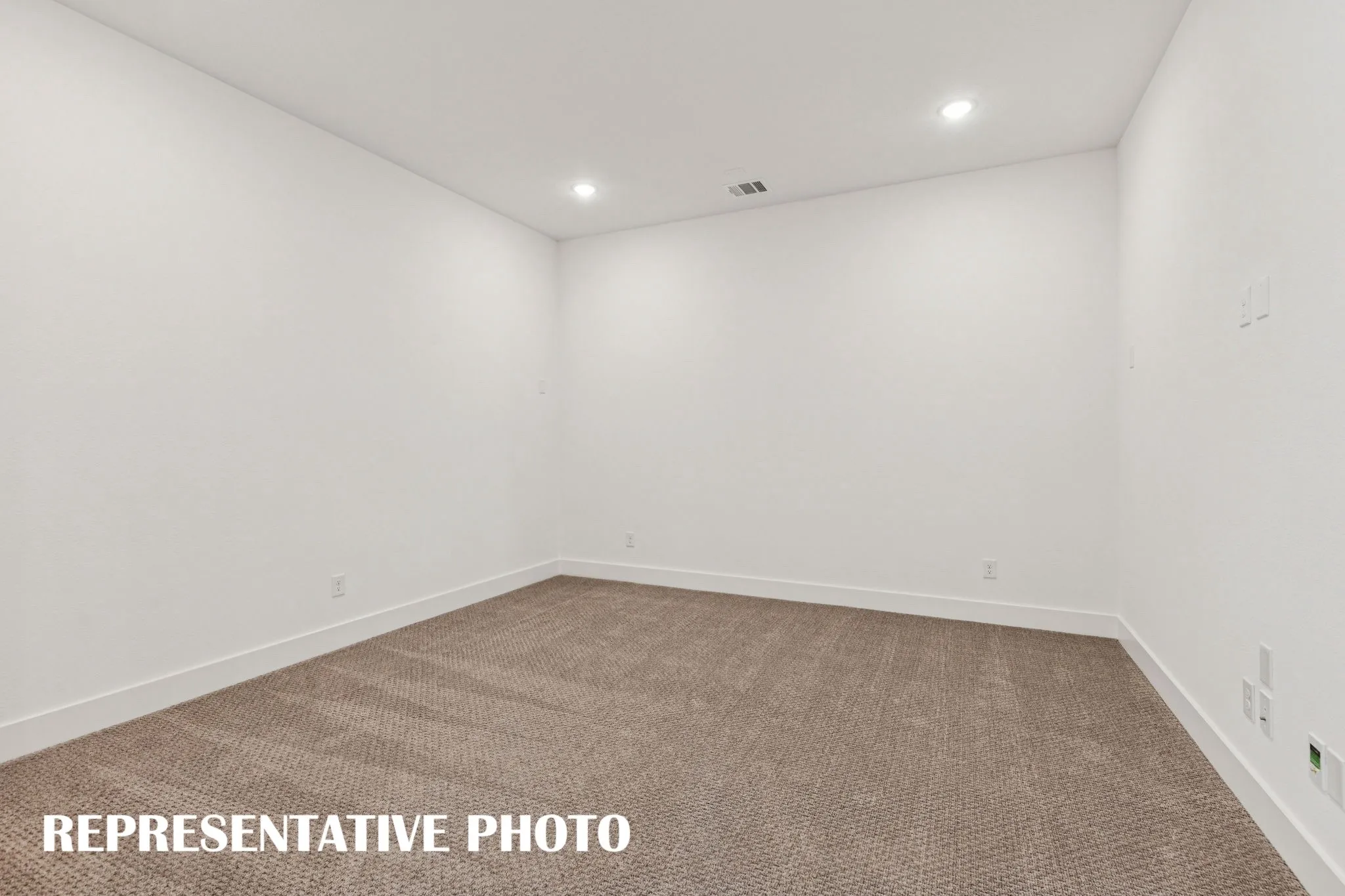 The spacious media room offers the perfect family entertainment area.  REPRESENTATIVE PHOTO